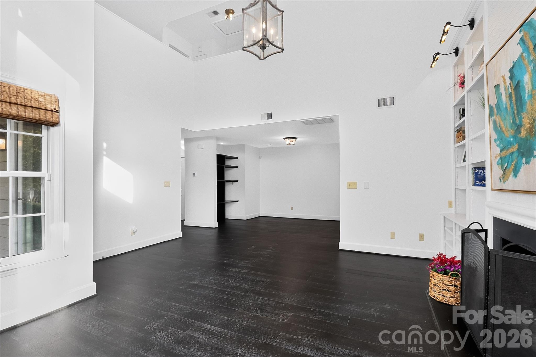 Living room looking into dining room - 8254 Tradd Court, Charlotte