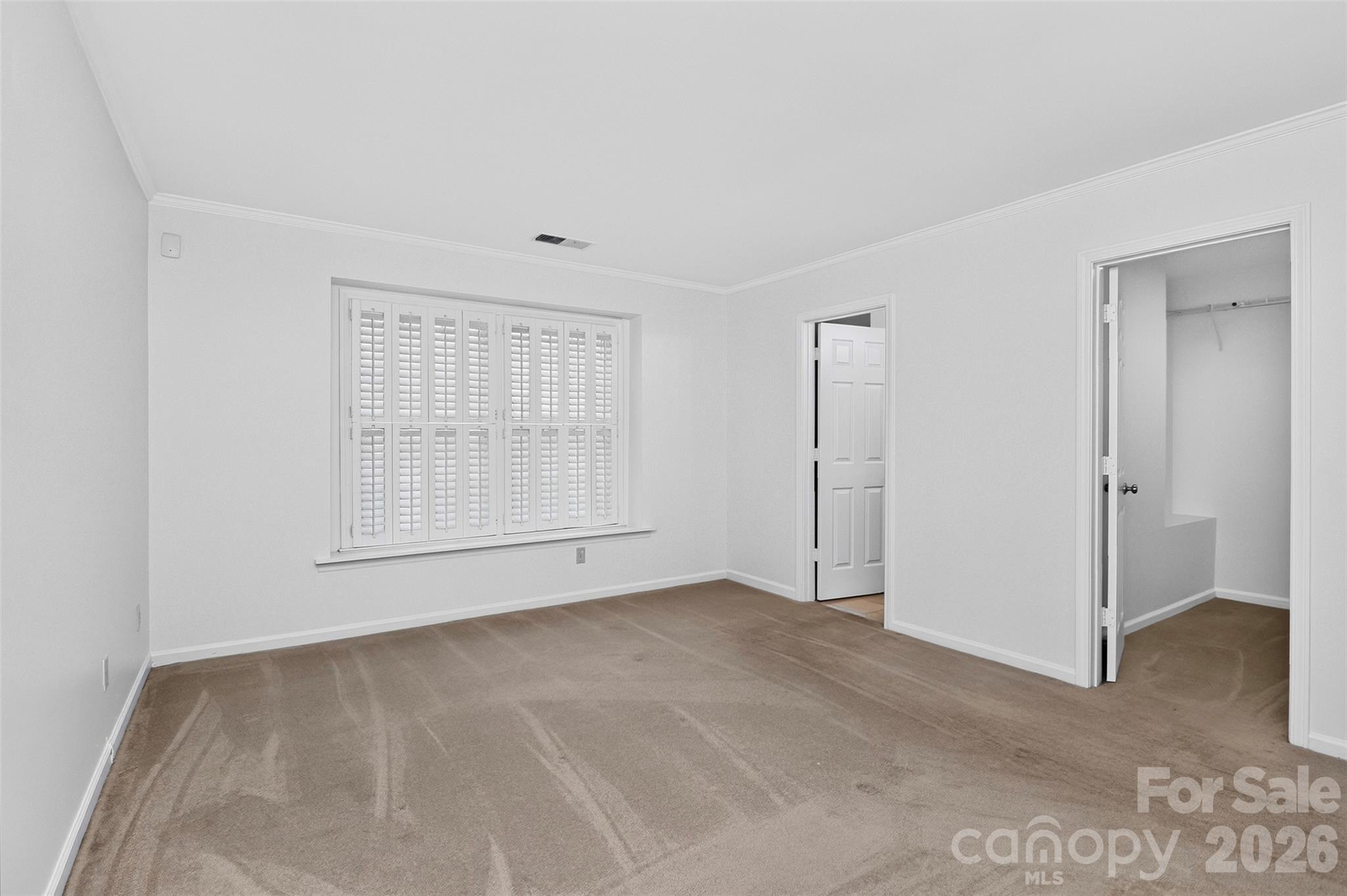 Primary suite with bath room and walk-in closet - 8254 Tradd Court, Charlotte