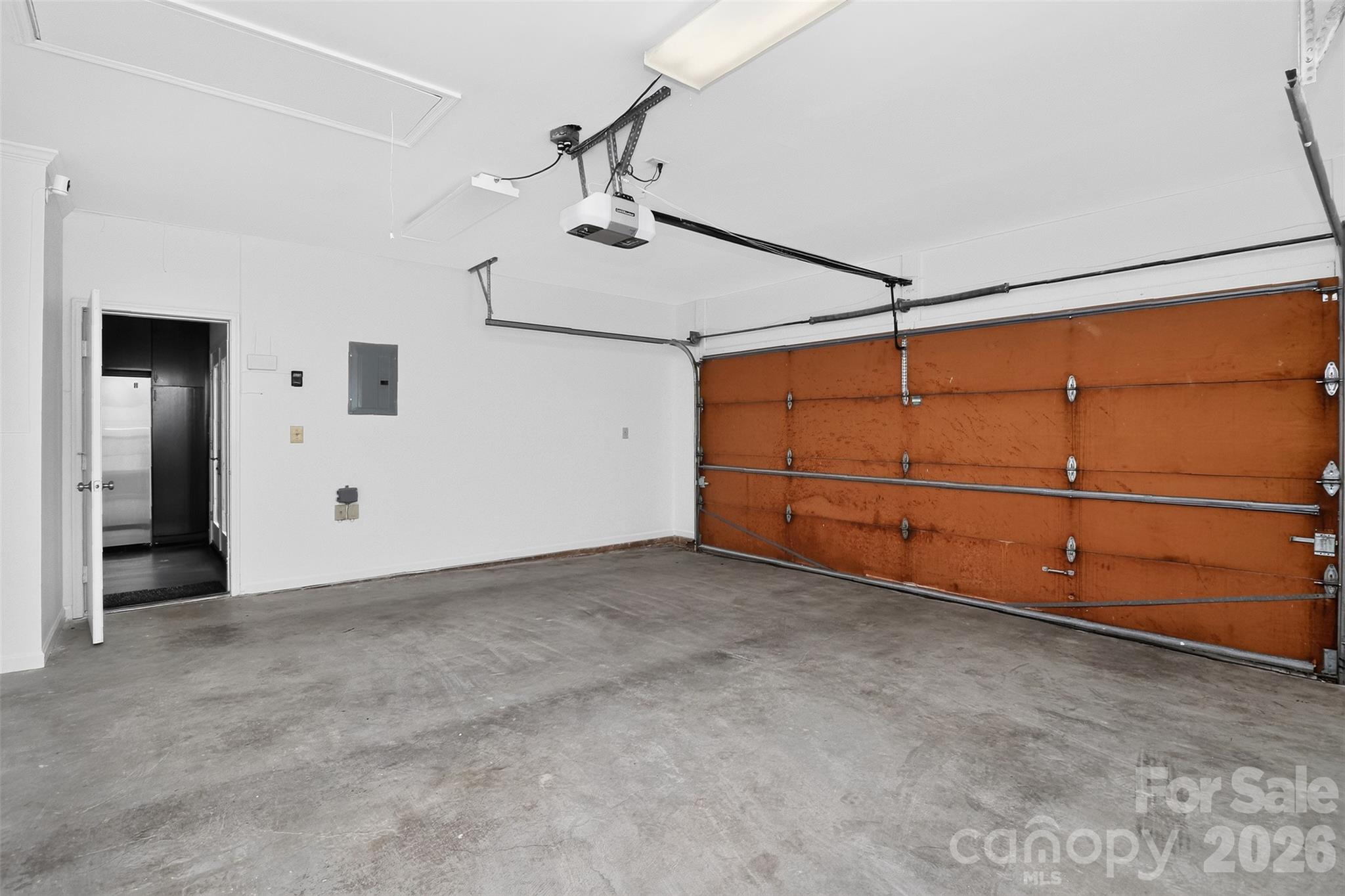 2-car garage and door to kitchen - 8254 Tradd Court, Charlotte