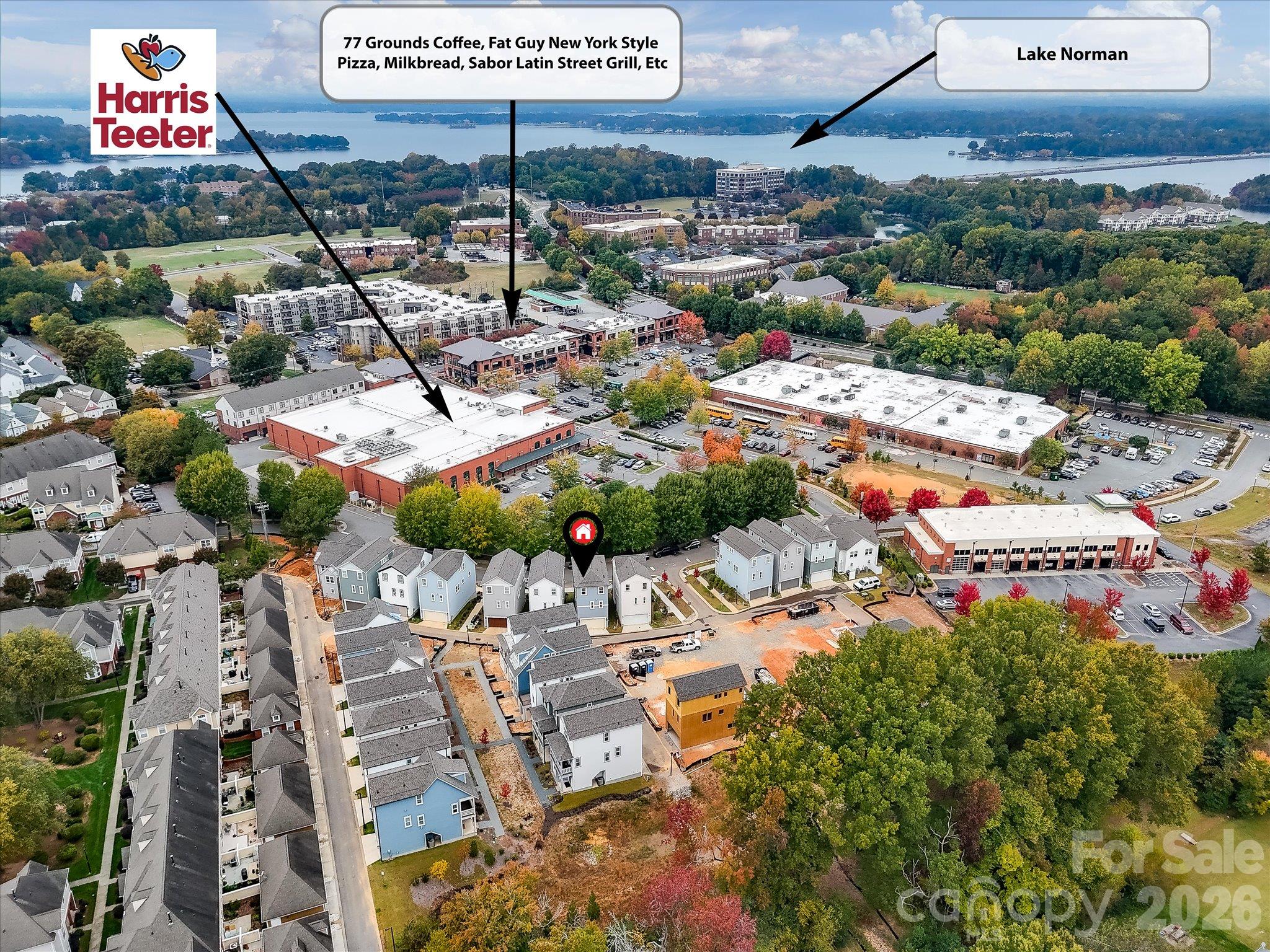 Aerial view highlighting the home's convenient location near Harris Teeter, popular restaurants, coffee shops, shopping, and beautiful Lake Norman. - 225 Davidson Gateway Drive, Davidson