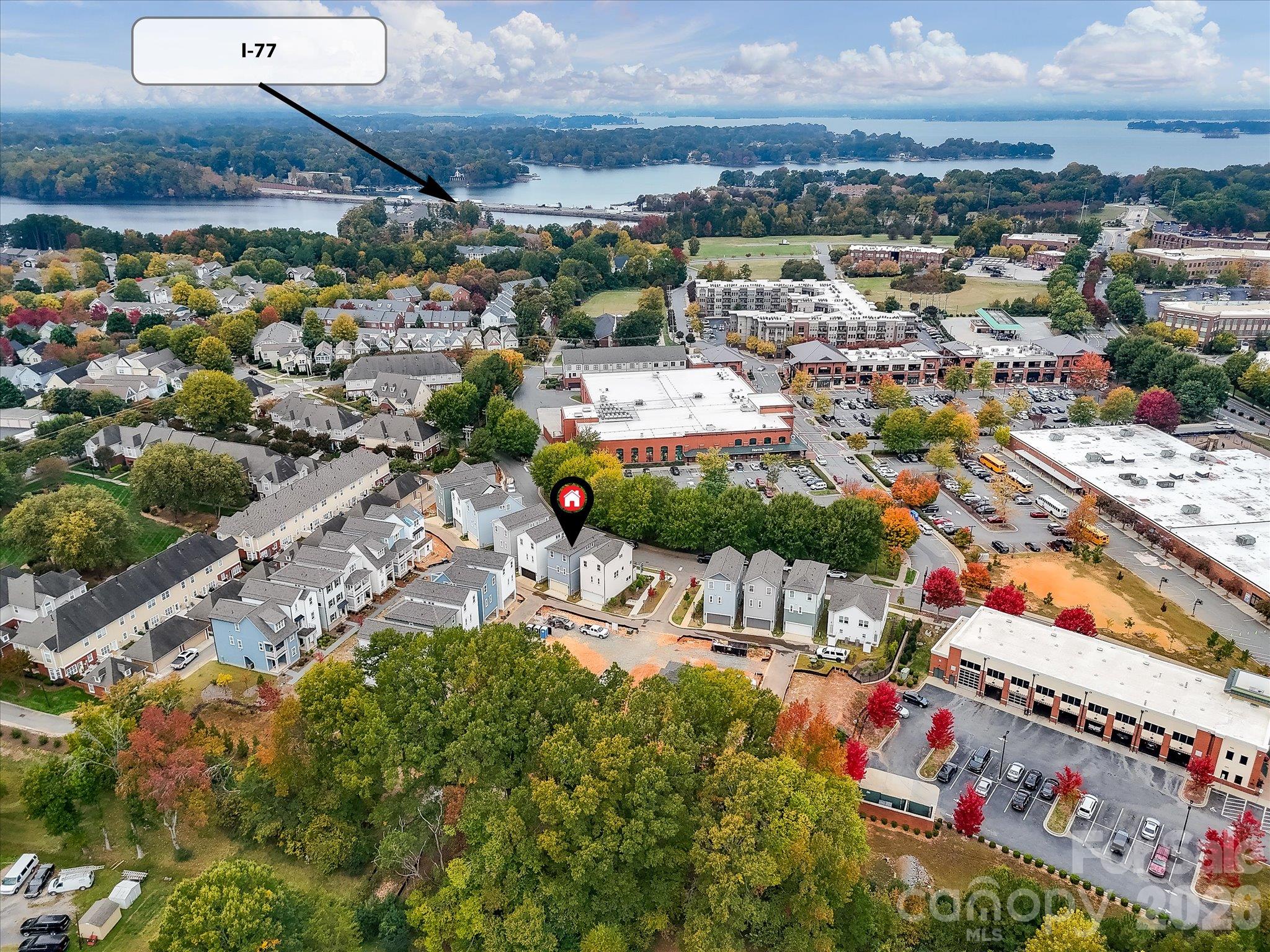 Aerial view highlighting the home's convenient location near shopping, dining, I-77, and scenic Lake Norman. - 225 Davidson Gateway Drive, Davidson