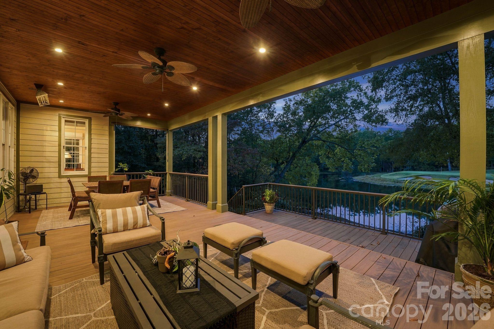 Covered screened in porch view at night - 347 Millingport Lane, New London