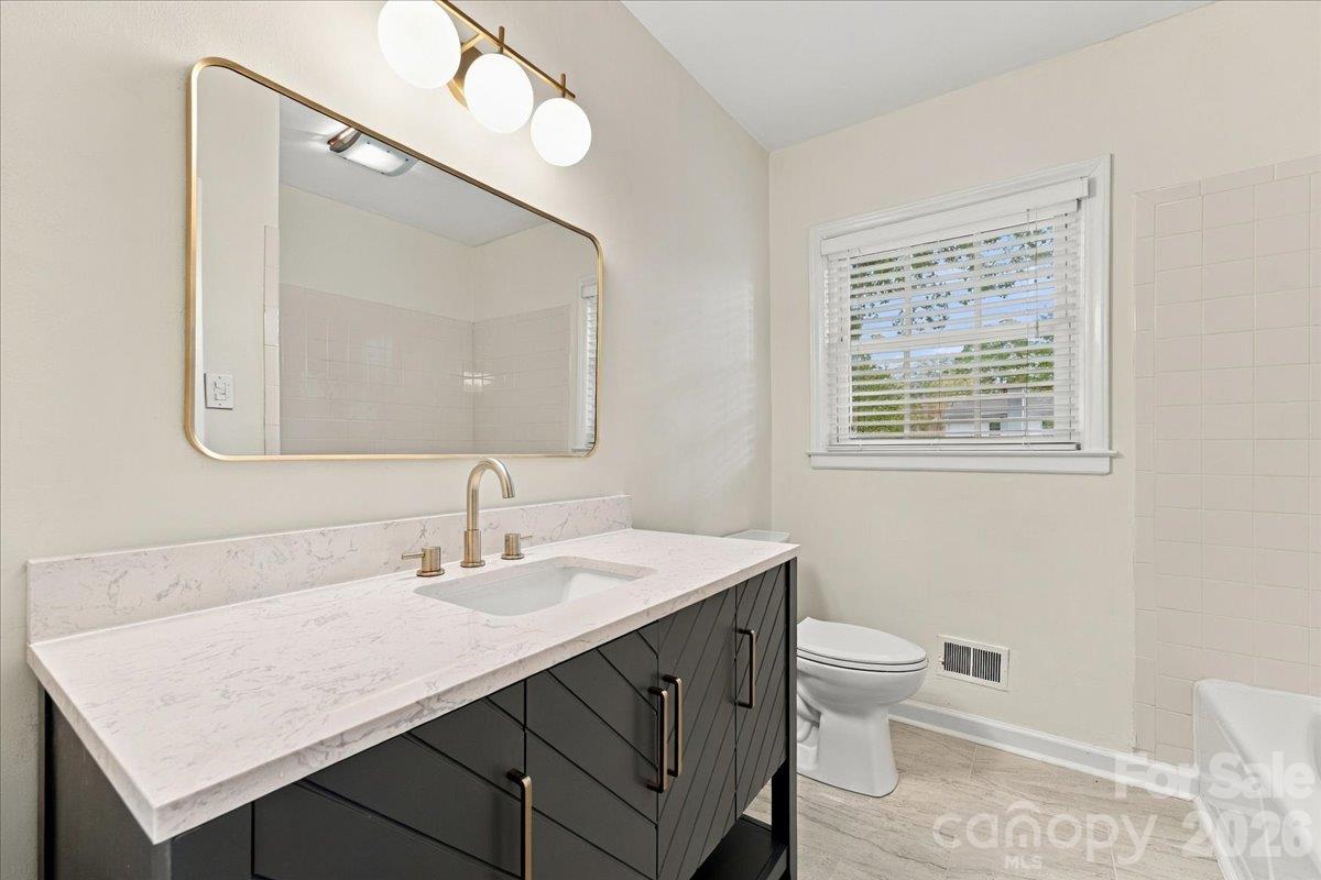 updated upstairs bathroom - 1312 Redcoat Drive, Charlotte
