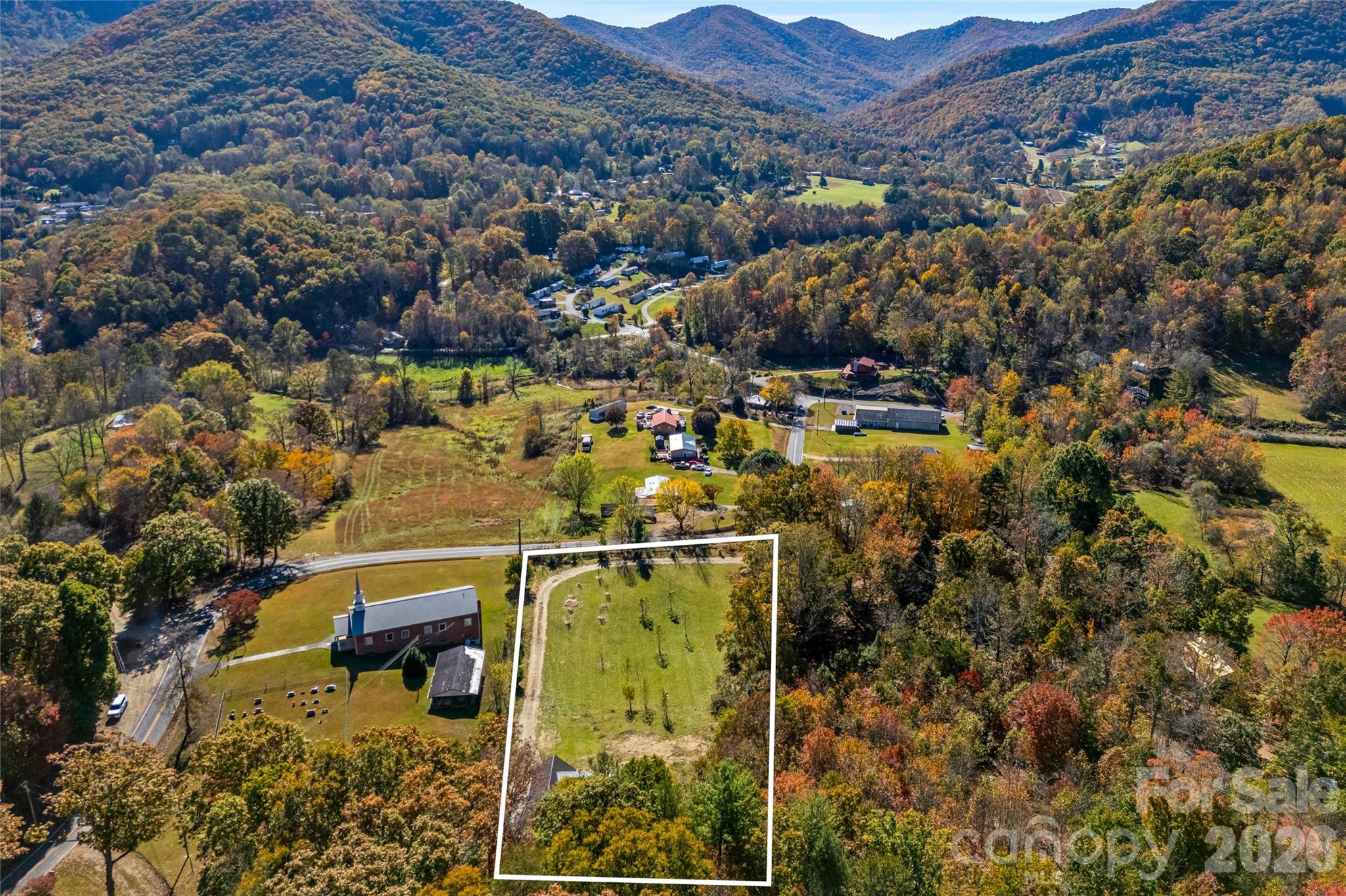 1.53 acres of predominantly level land surrounded by mountain beauty. - 205 Blue Moon Lane, Candler