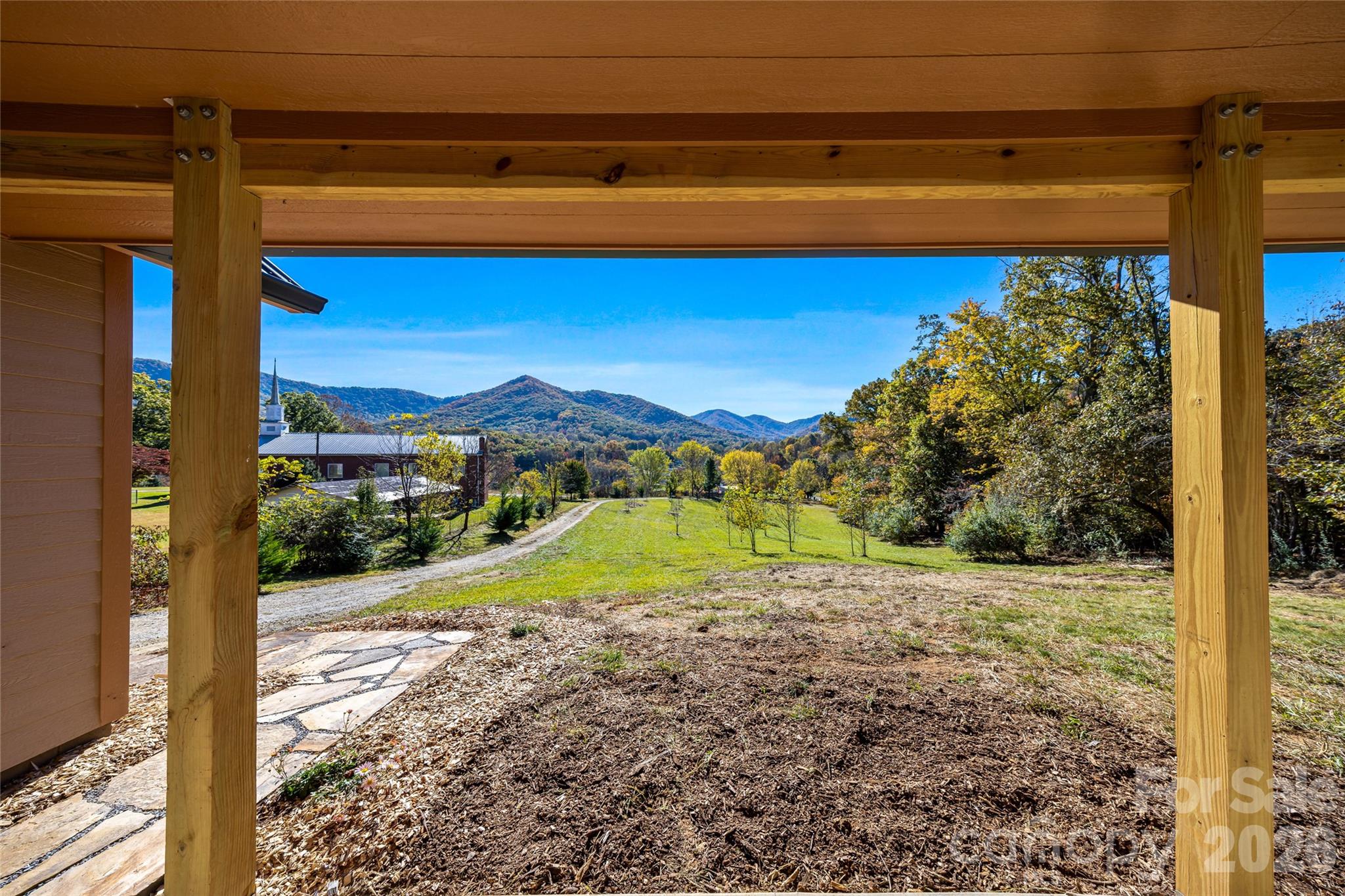 Sweeping mountain views from the covered porch. - 205 Blue Moon Lane, Candler