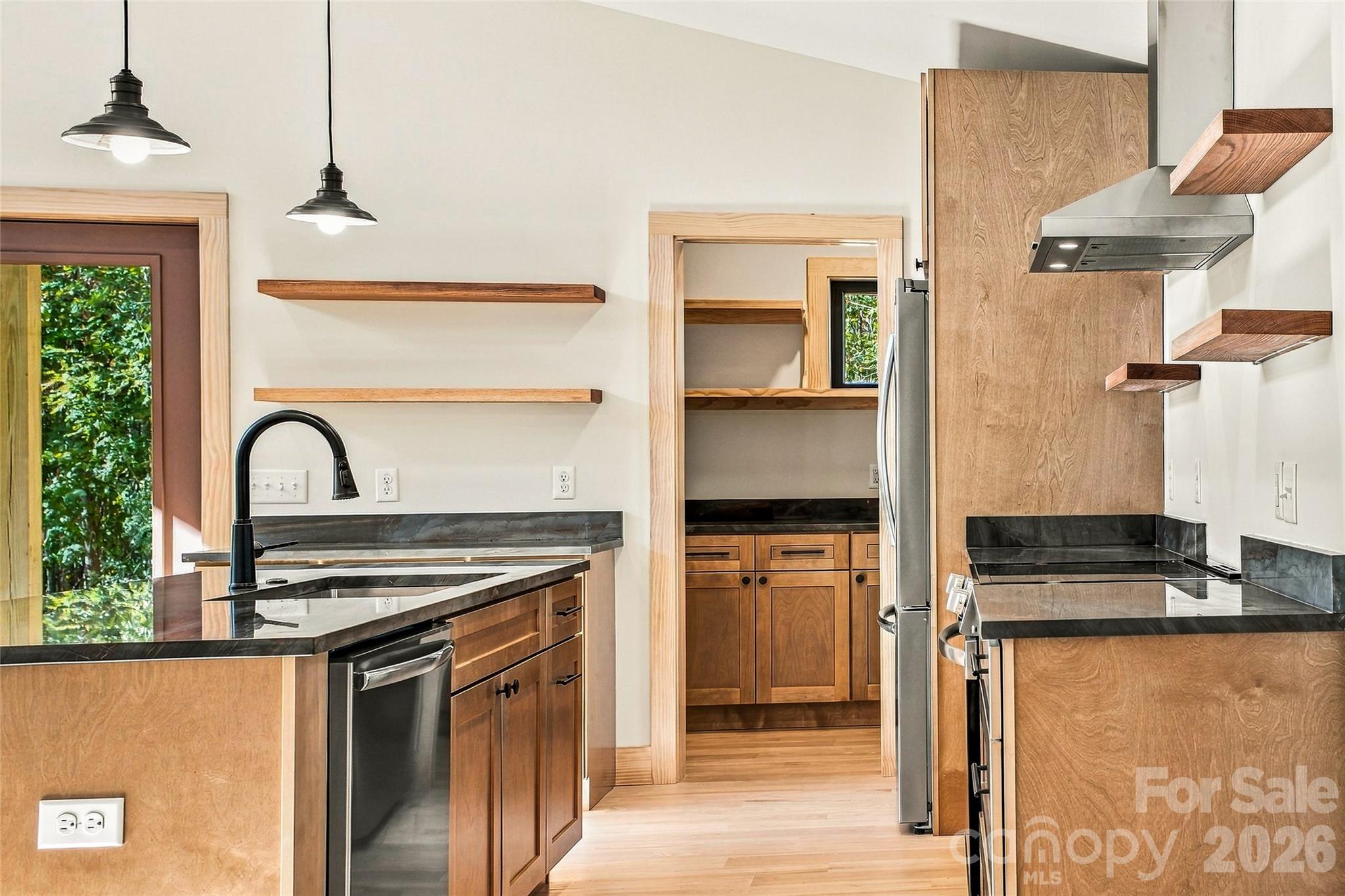 Beautifully crafted kitchen with generous workspace and storage. - 205 Blue Moon Lane, Candler