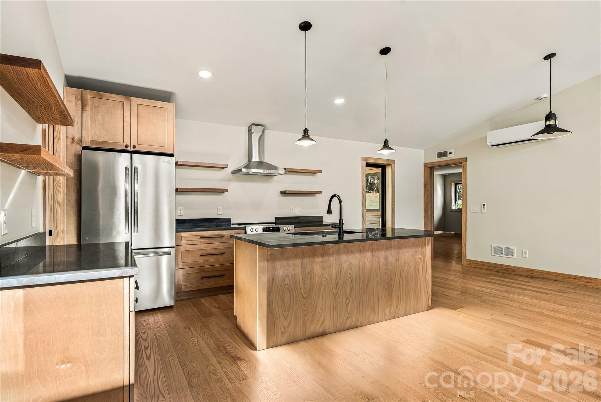 Spacious kitchen island ideal for cooking and entertaining. - 205 Blue Moon Lane, Candler