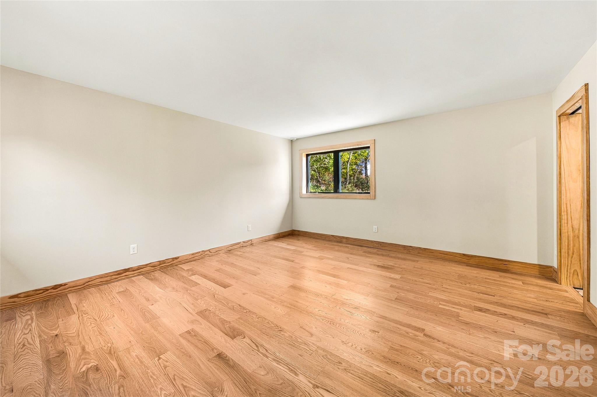 Comfortable bedroom with beautiful natural wood flooring. - 205 Blue Moon Lane, Candler