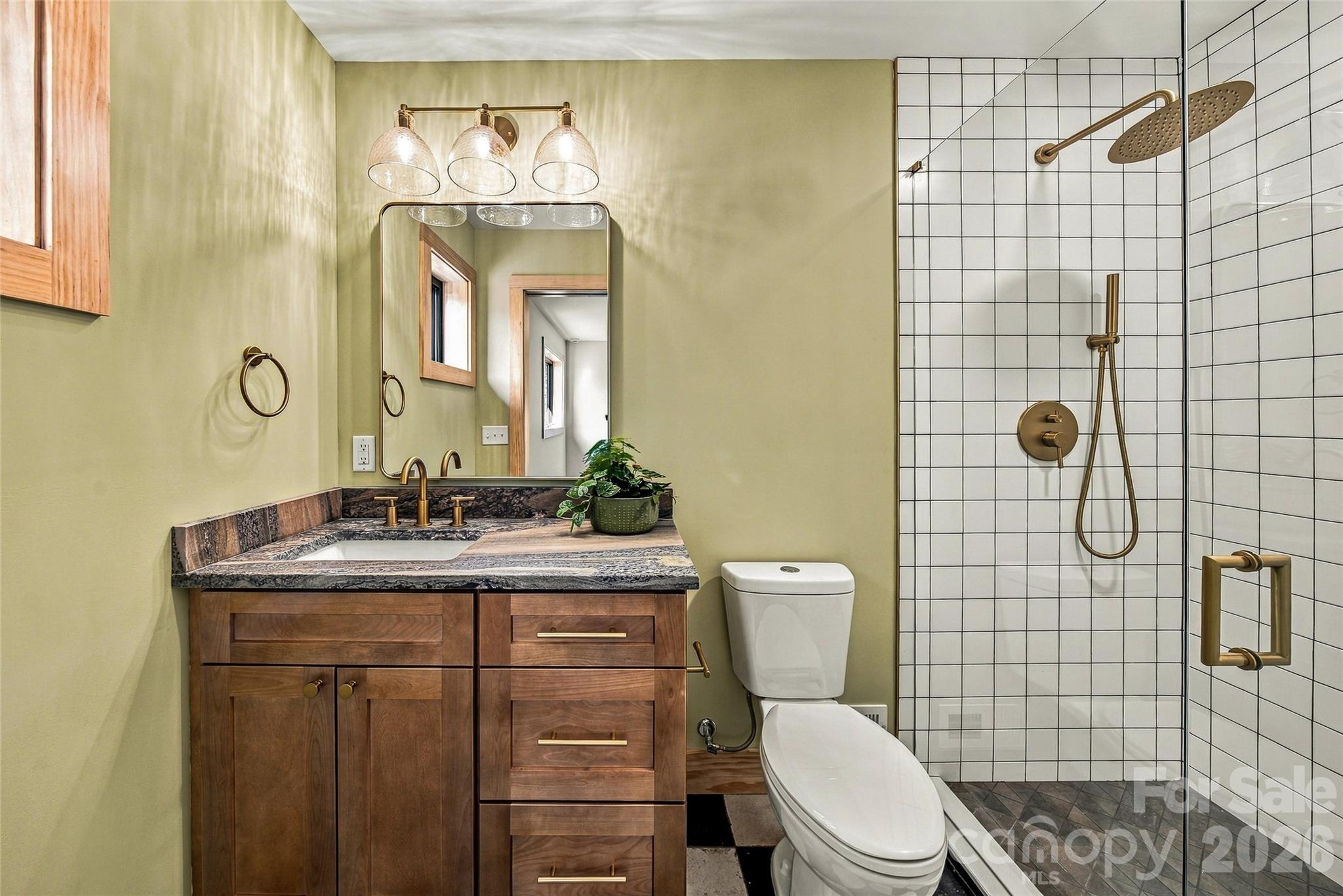 Beautifully finished bathroom with a tiled walk-in shower. - 205 Blue Moon Lane, Candler