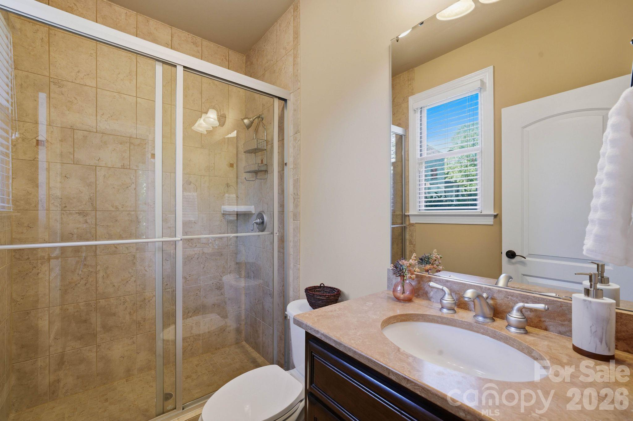 Guest suite bathroom (main level) - 8407 Rolling Fields Road, Mint Hill
