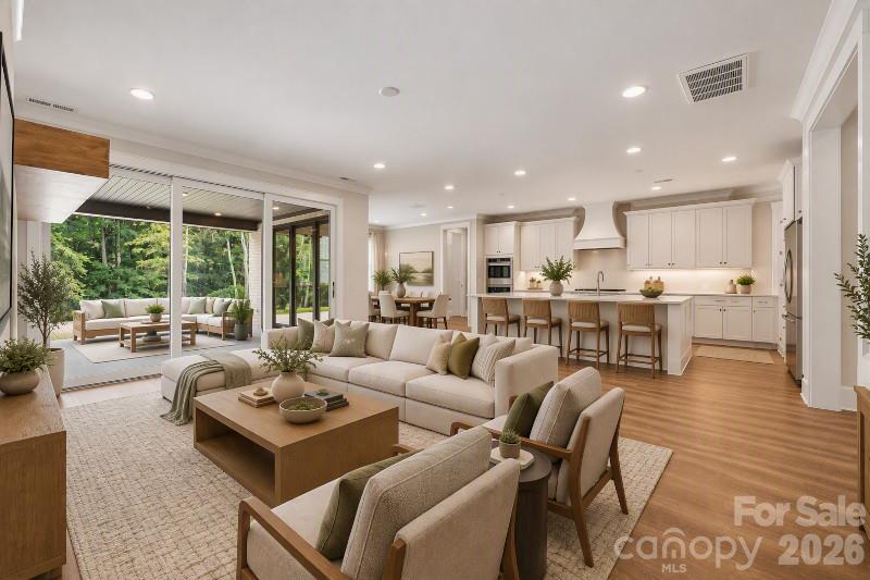Virtually Staged Great room and kitchen - 10938 Old Ravine Trail, Huntersville
