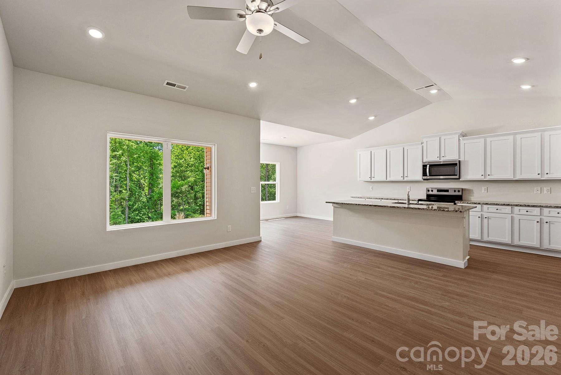 Kitchen seamlessly connects to the dining and living areas. - 1426 Tristen Road, Richburg
