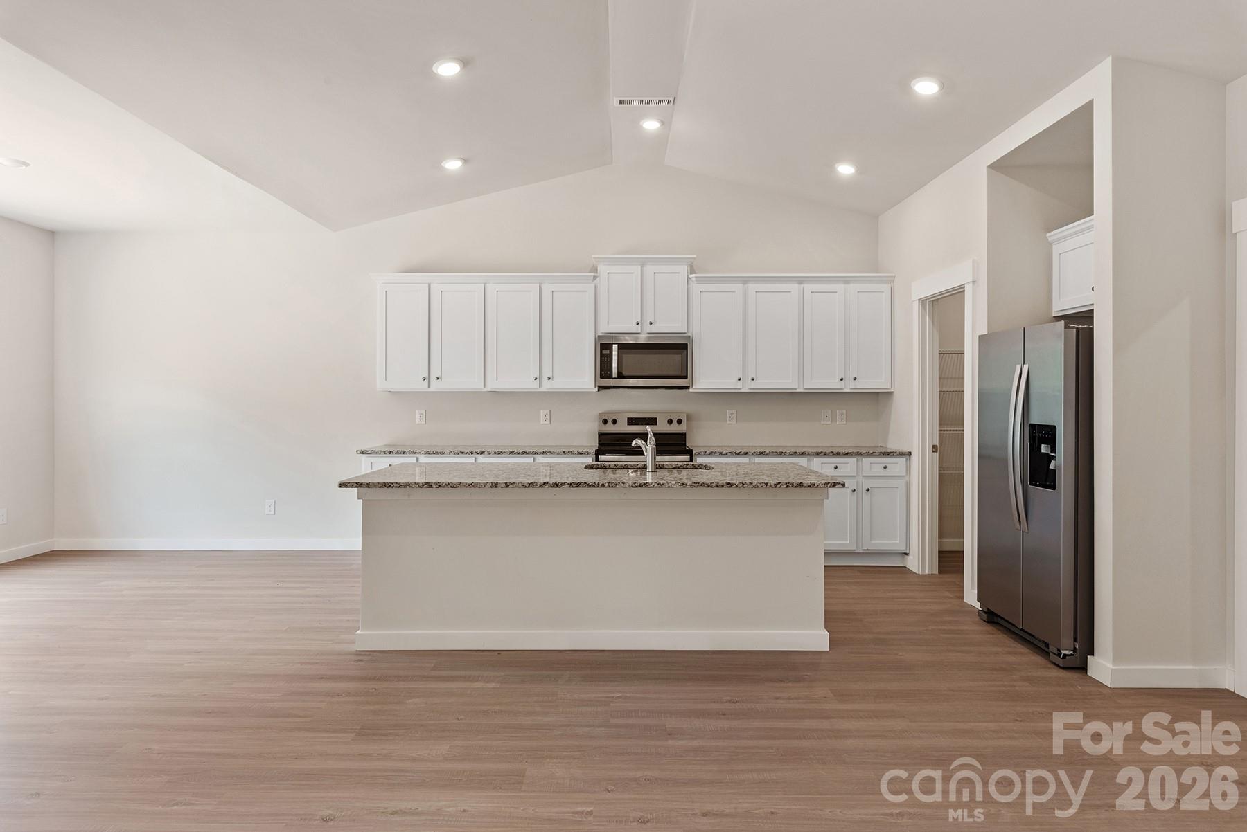 Open-concept kitchen designed for everyday living and entertaining. - 1426 Tristen Road, Richburg