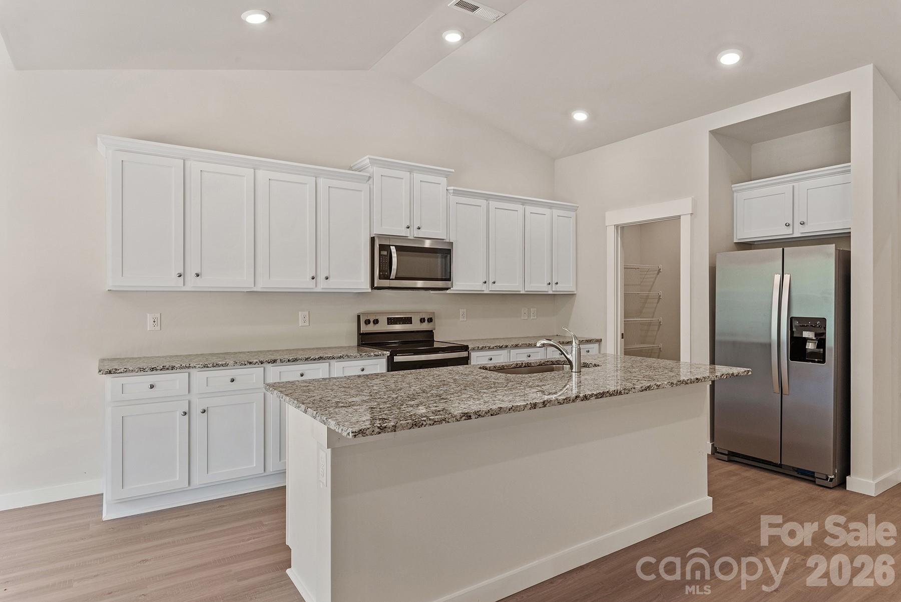Ample counter space and cabinetry provide everyday functionality. - 1426 Tristen Road, Richburg