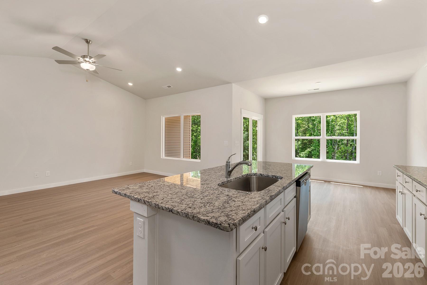 Large center island offers additional prep space and seating opportunities. - 1426 Tristen Road, Richburg