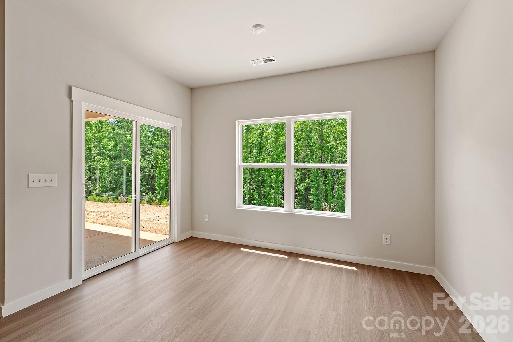 Inviting dining space filled with natural light and convenient patio access. - 1426 Tristen Road, Richburg