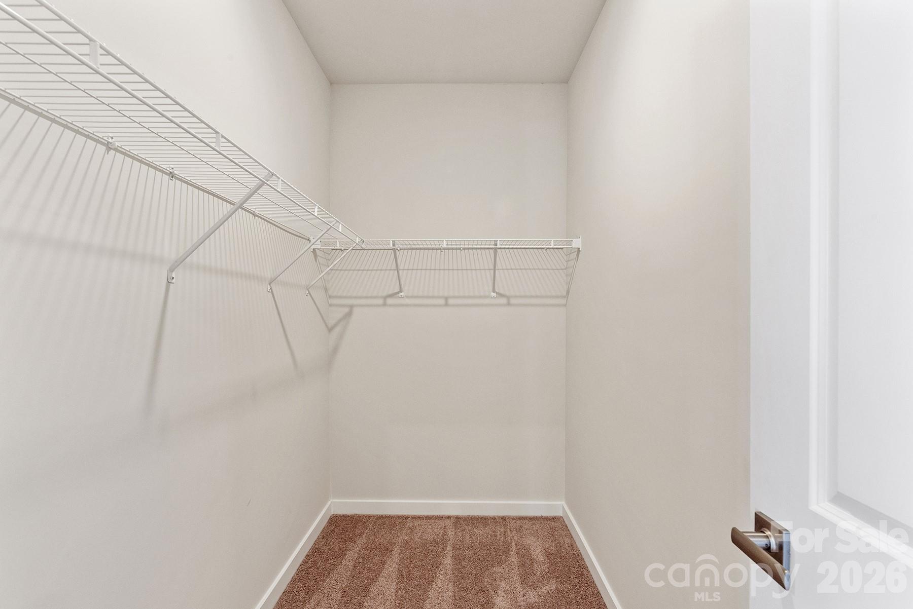 Walk-in closet provides generous storage and organization space. - 1426 Tristen Road, Richburg