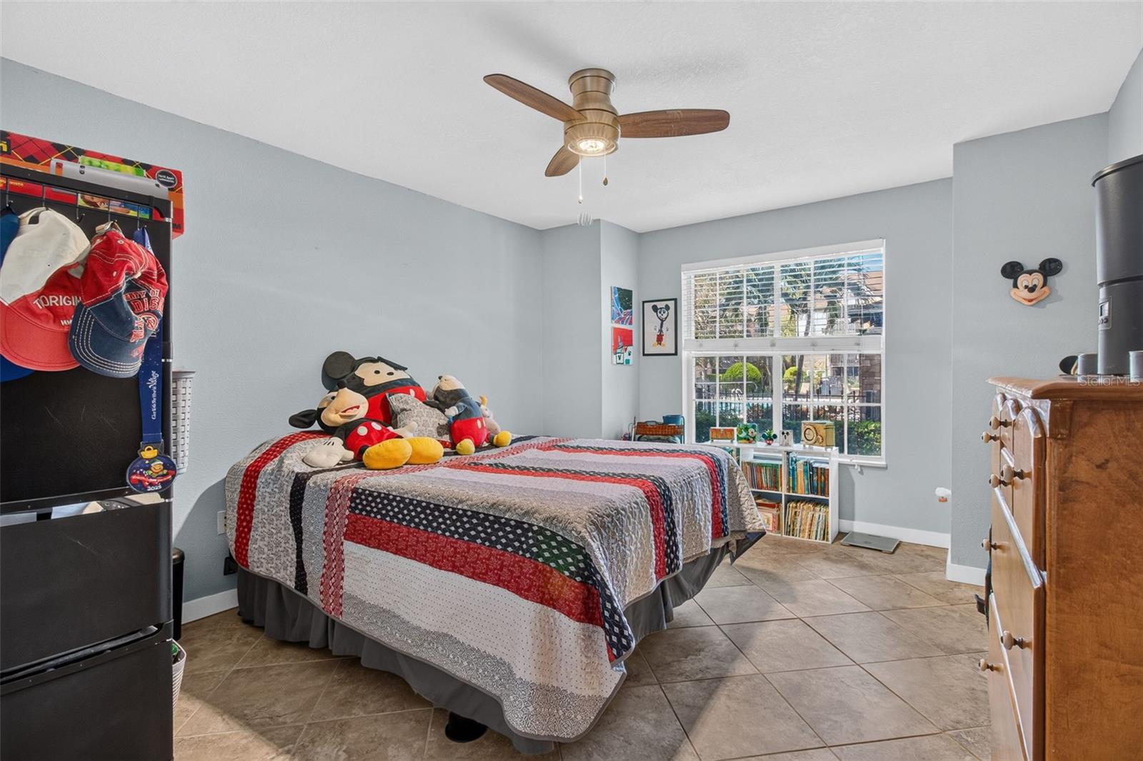 Primary bedroom. View to the pool. - 2500 WINDING CREEK BLVD #I106, CLEARWATER