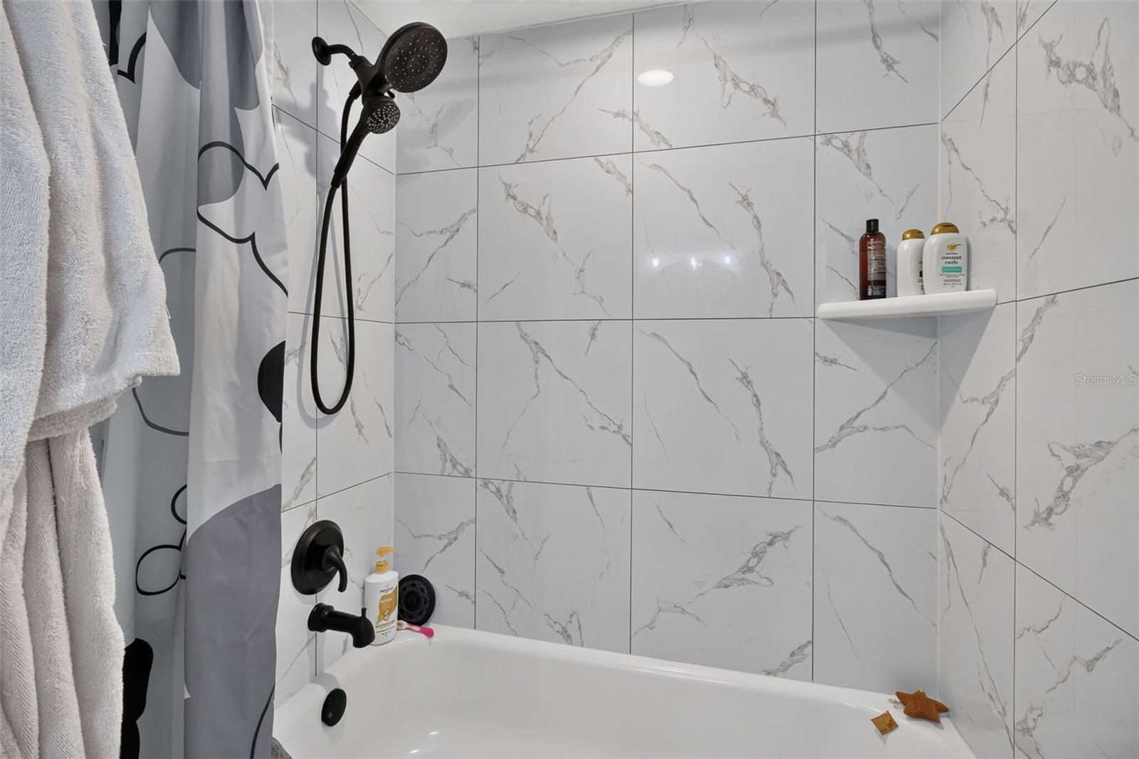 Primary bath new tub and tiled shower - 2500 WINDING CREEK BLVD #I106, CLEARWATER