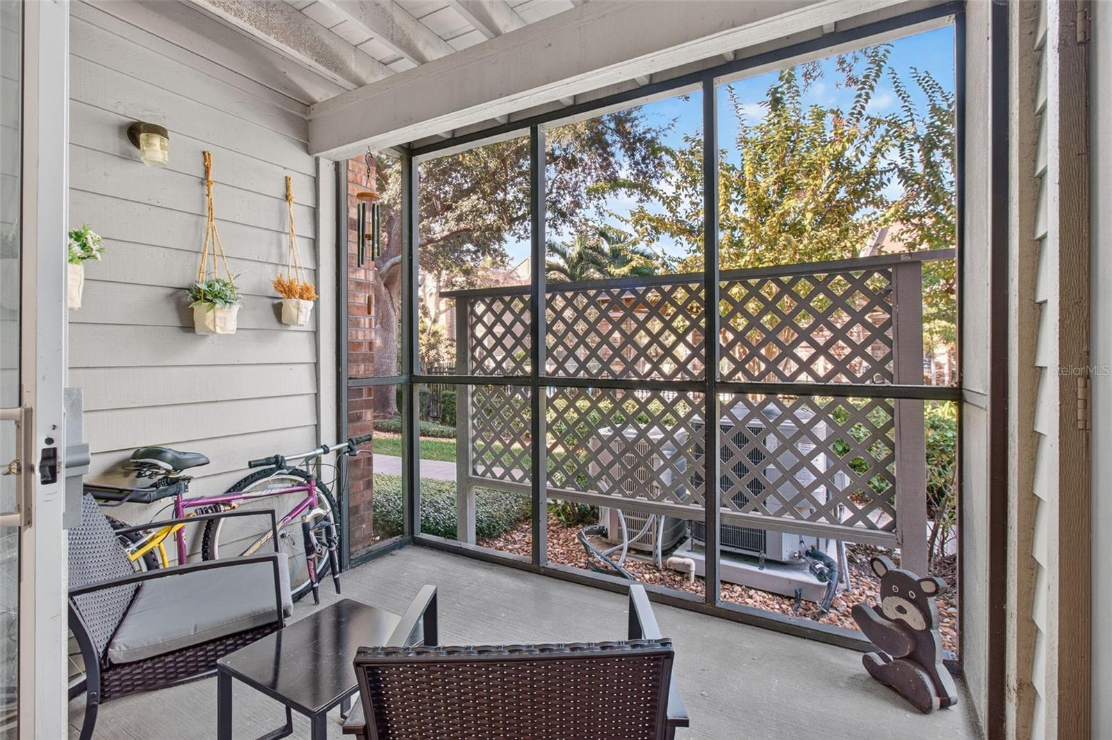 Rear screened-in porch facing north, pool view - 2500 WINDING CREEK BLVD #I106, CLEARWATER