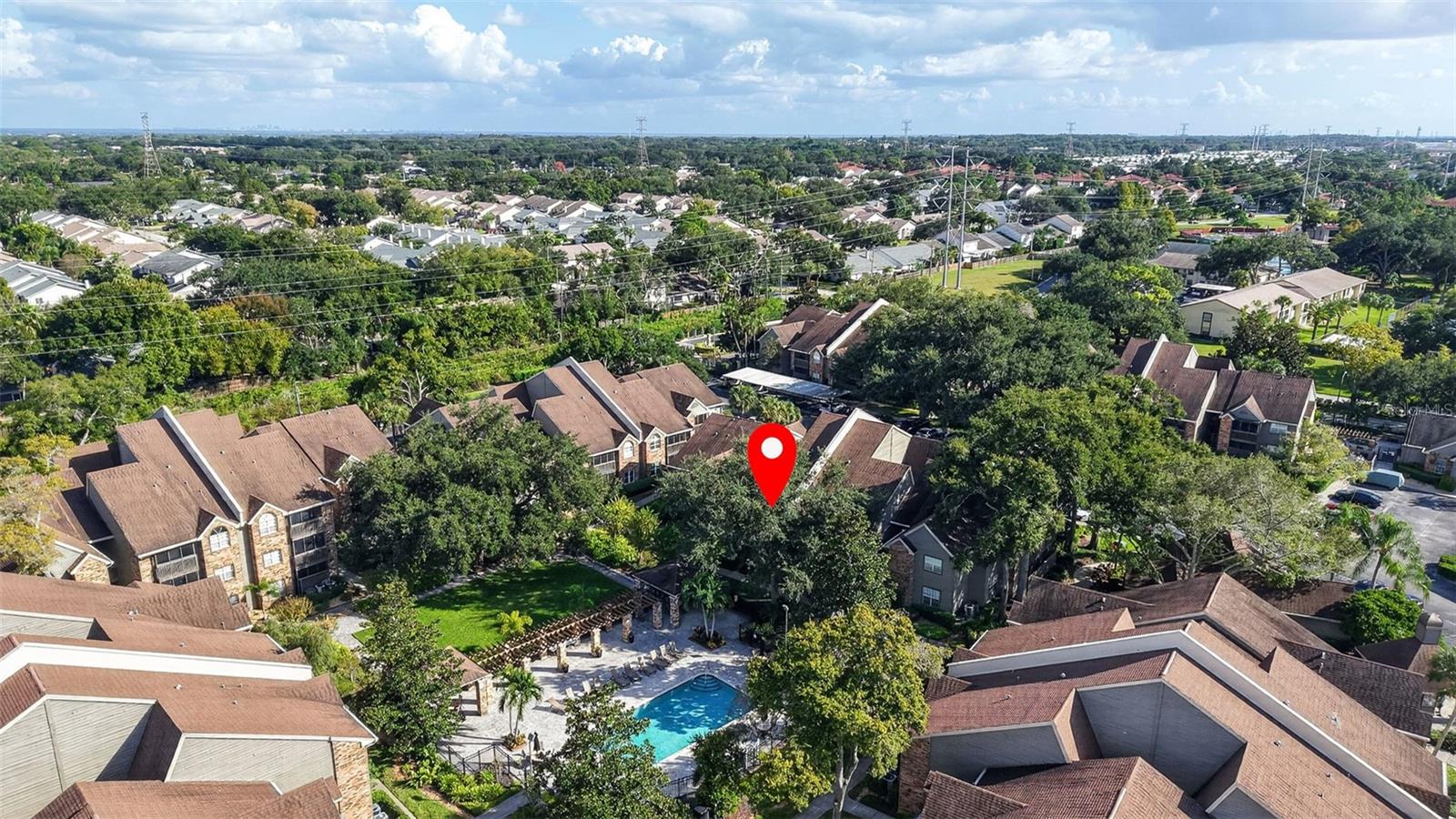 View of unit and pool - 2500 WINDING CREEK BLVD #I106, CLEARWATER
