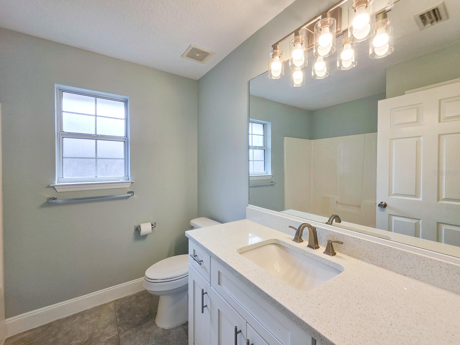 Shared bath with stone top - 4 LLOWICK CT, PALM COAST