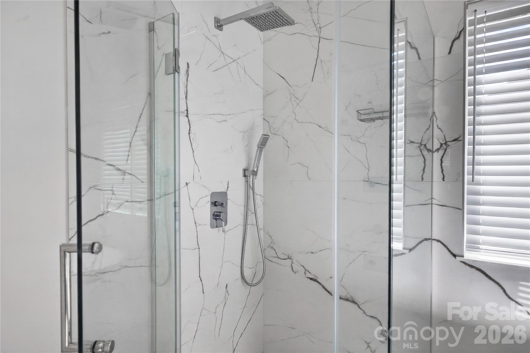 Modern shower with an overhead rain head and handheld wand - 12520 Vantage Point Lane, Huntersville