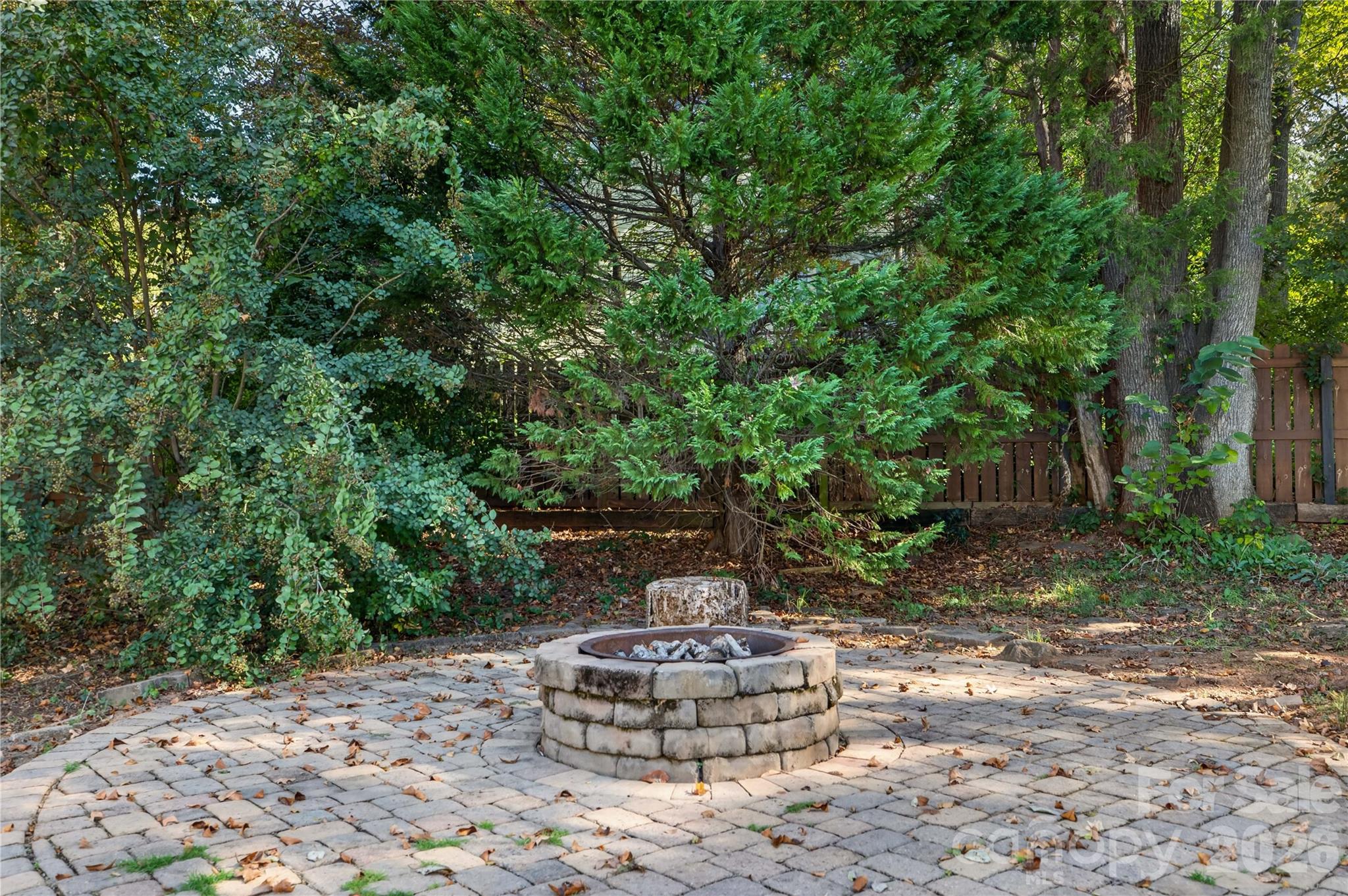 An inviting outdoor gathering space for cozy evenings around the fire - 12520 Vantage Point Lane, Huntersville