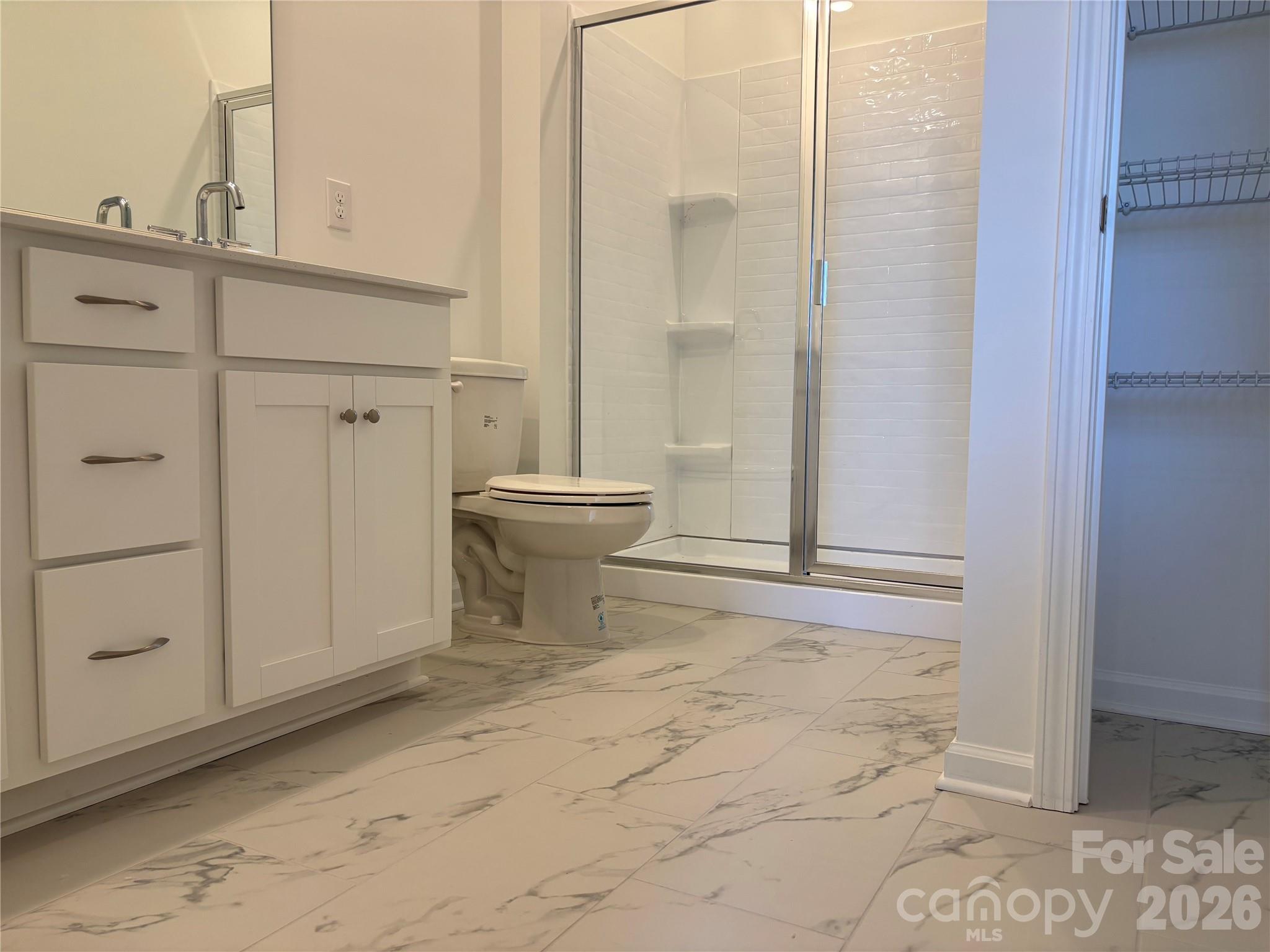 Nice Tile floors and Linen closet in the private bath off of the guest room down - 1735 Grassy Knoll Trail, Maiden
