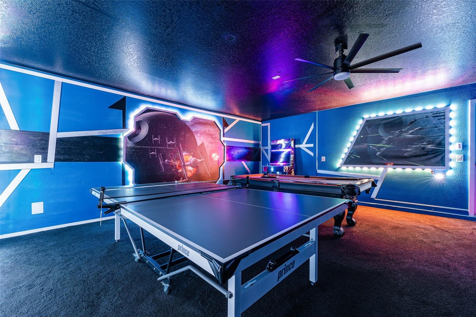 Let the Games Begin! Air-Conditioned Game Room Featuring Vibrant LED Lighting, Pool Table, Arcade Games and More - 1520 MOON VALLEY DR, DAVENPORT