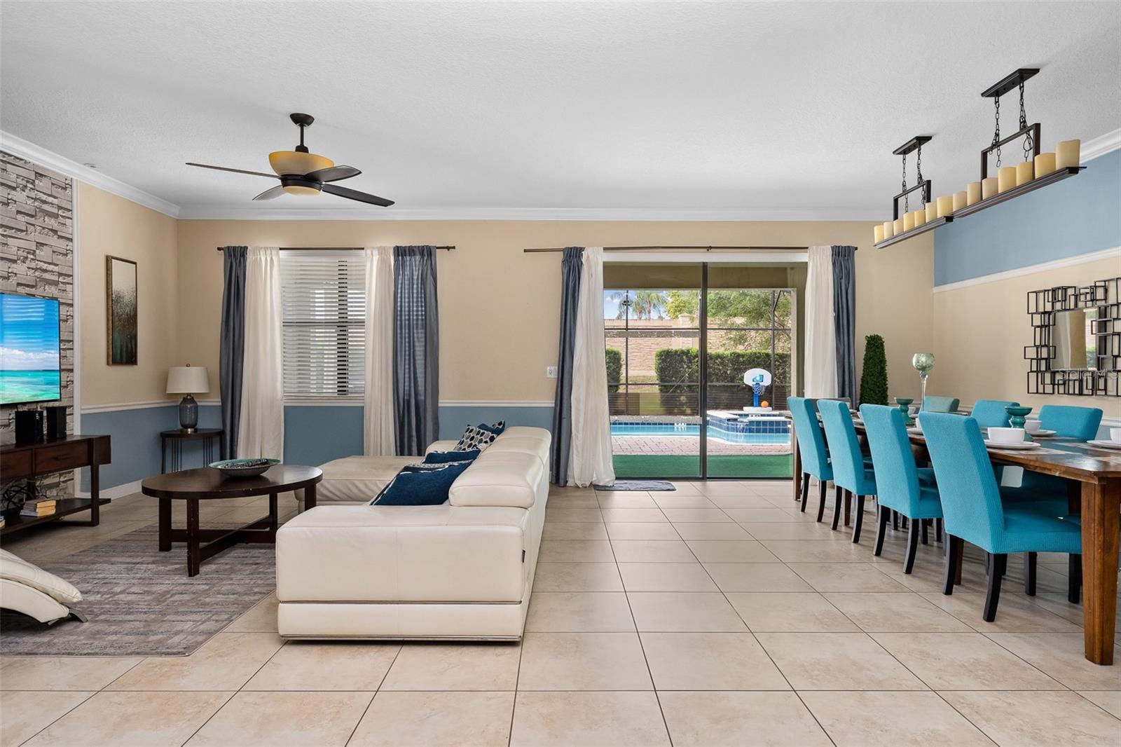 Seamless Open-Concept Living Connects the Kitchen, Dining and Family Room with Views Toward the Pool - 1520 MOON VALLEY DR, DAVENPORT