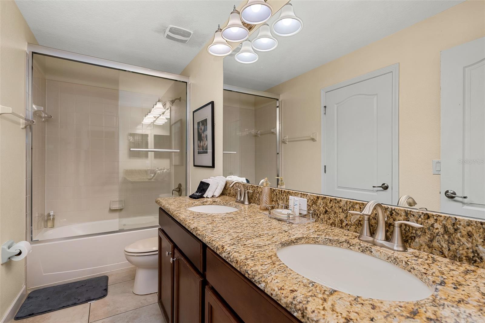 Additional View of the Primary Bathroom with Granite Countertops and Double Vanity - 1520 MOON VALLEY DR, DAVENPORT
