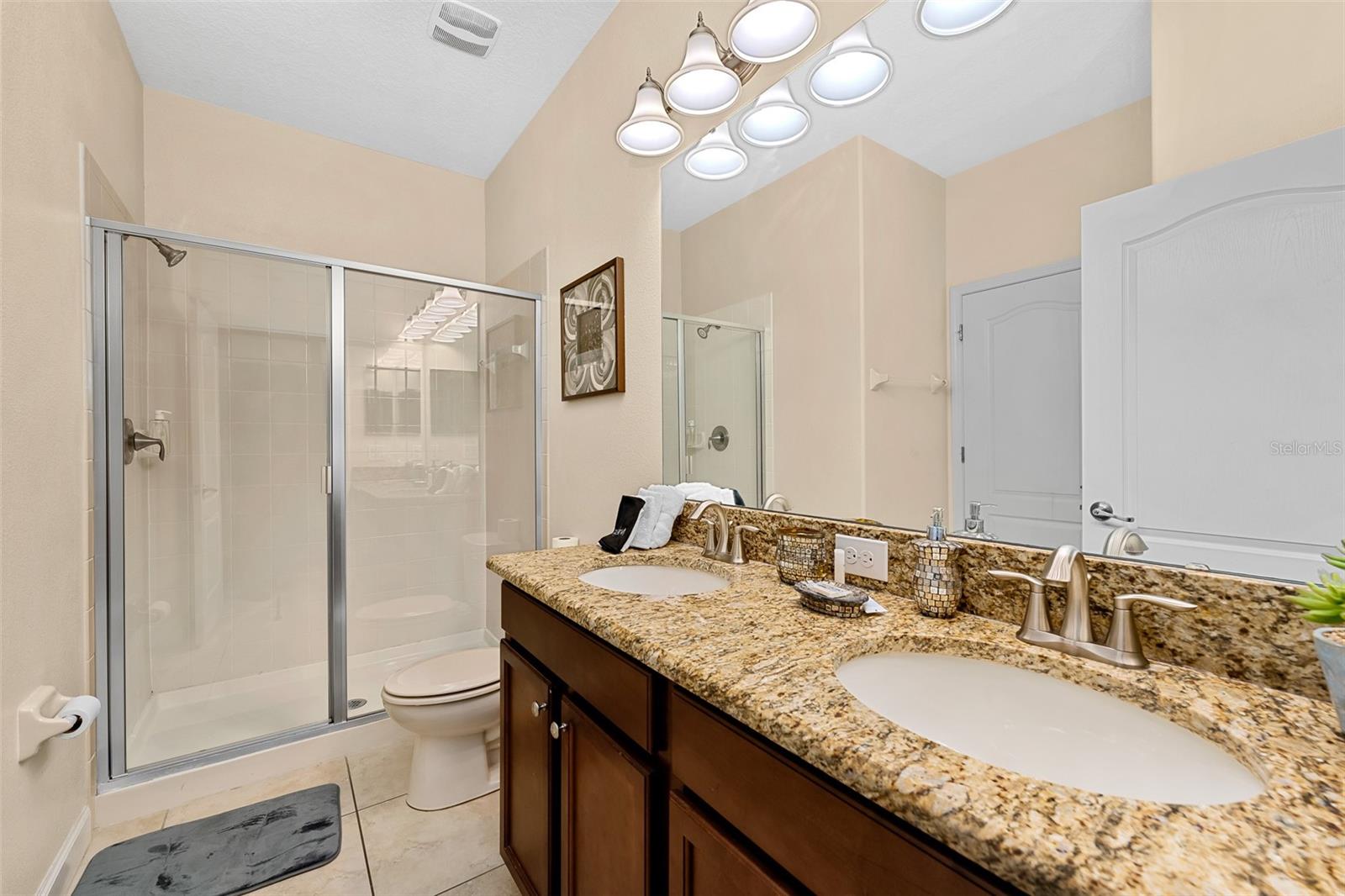 Full Bathroom with Granite Vanity and Tub/Shower Combination - 1520 MOON VALLEY DR, DAVENPORT