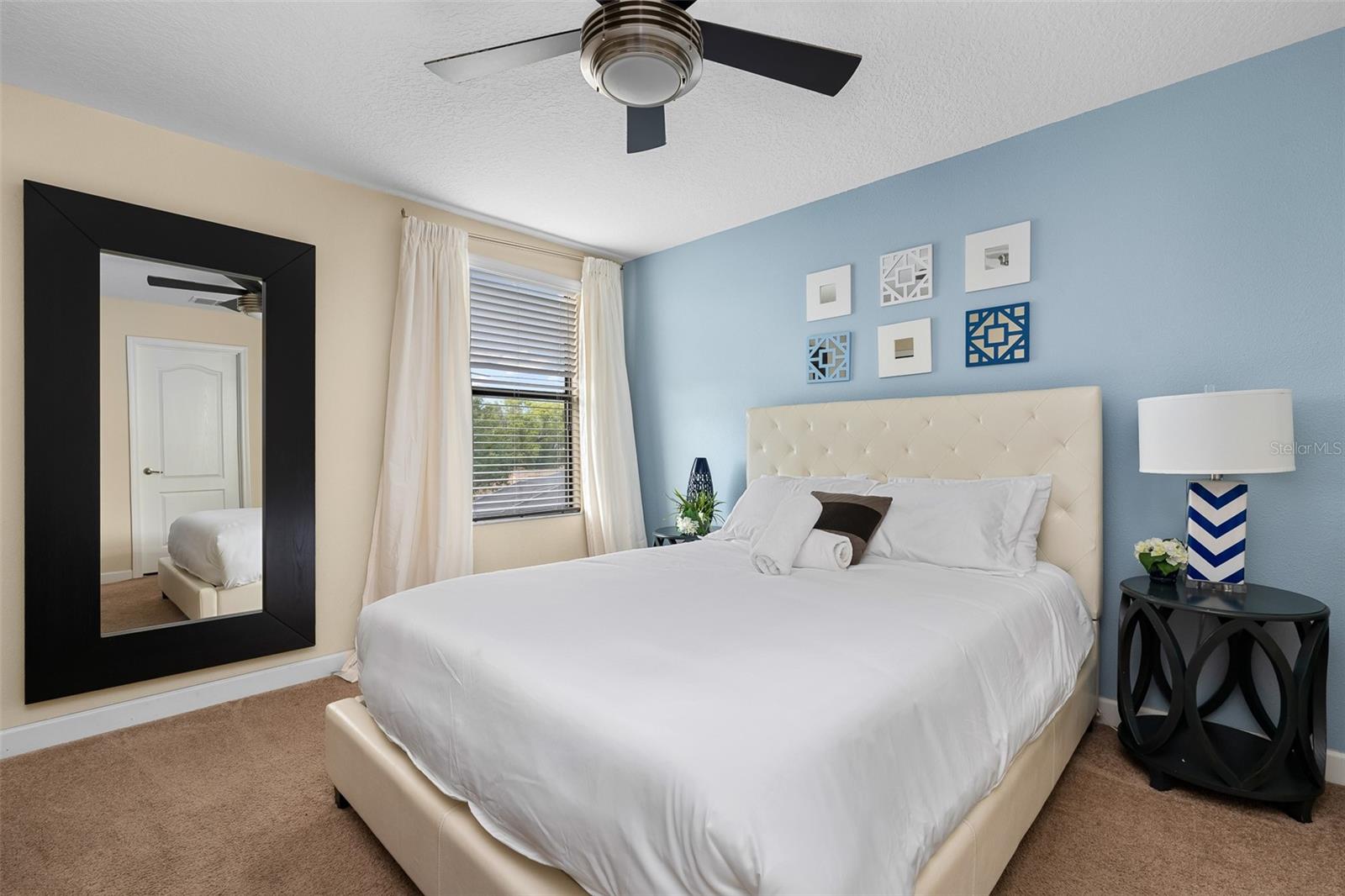 Comfortable Guest Bedroom with Queen Bed and Soft Blue Accents - 1520 MOON VALLEY DR, DAVENPORT
