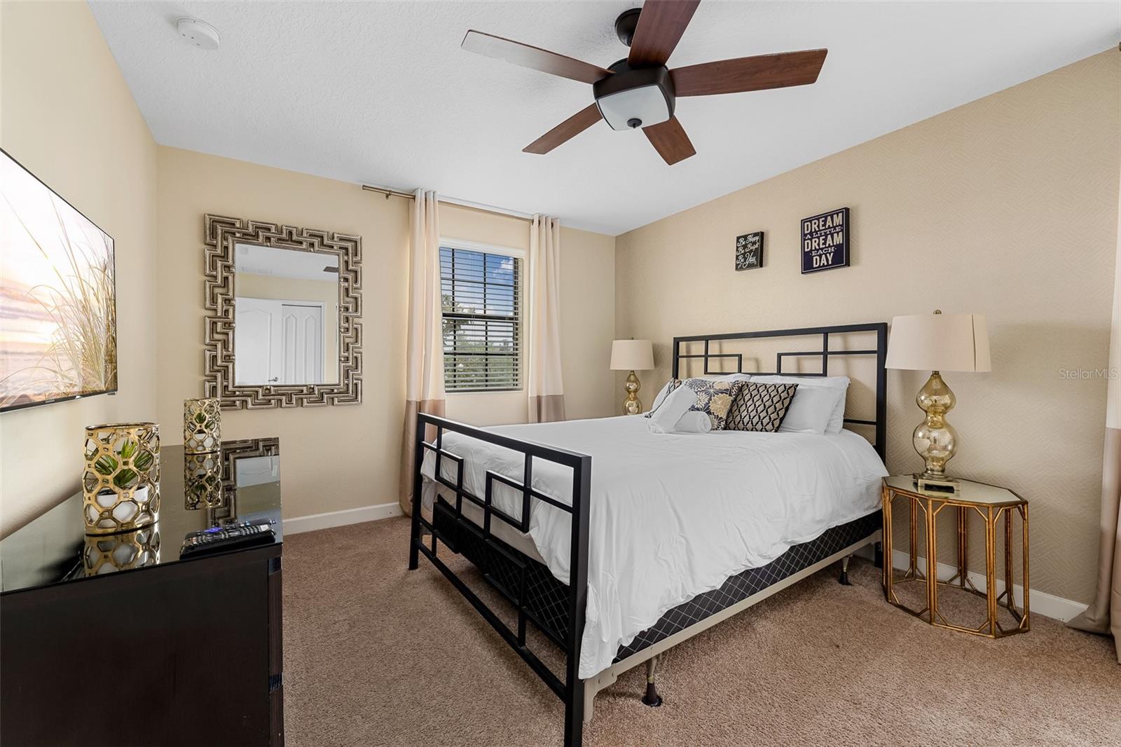 Spacious Second-Floor Primary Suite with King Bed and Ceiling Fan - 1520 MOON VALLEY DR, DAVENPORT