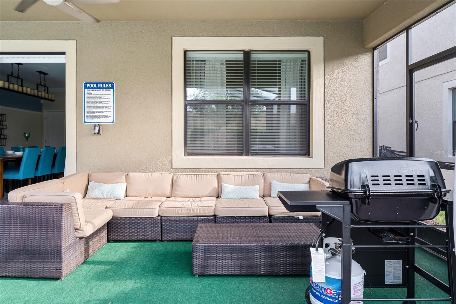 Outdoor Living at Its Best with Lounge Seating, Dining Space and Grilling Area - 1520 MOON VALLEY DR, DAVENPORT