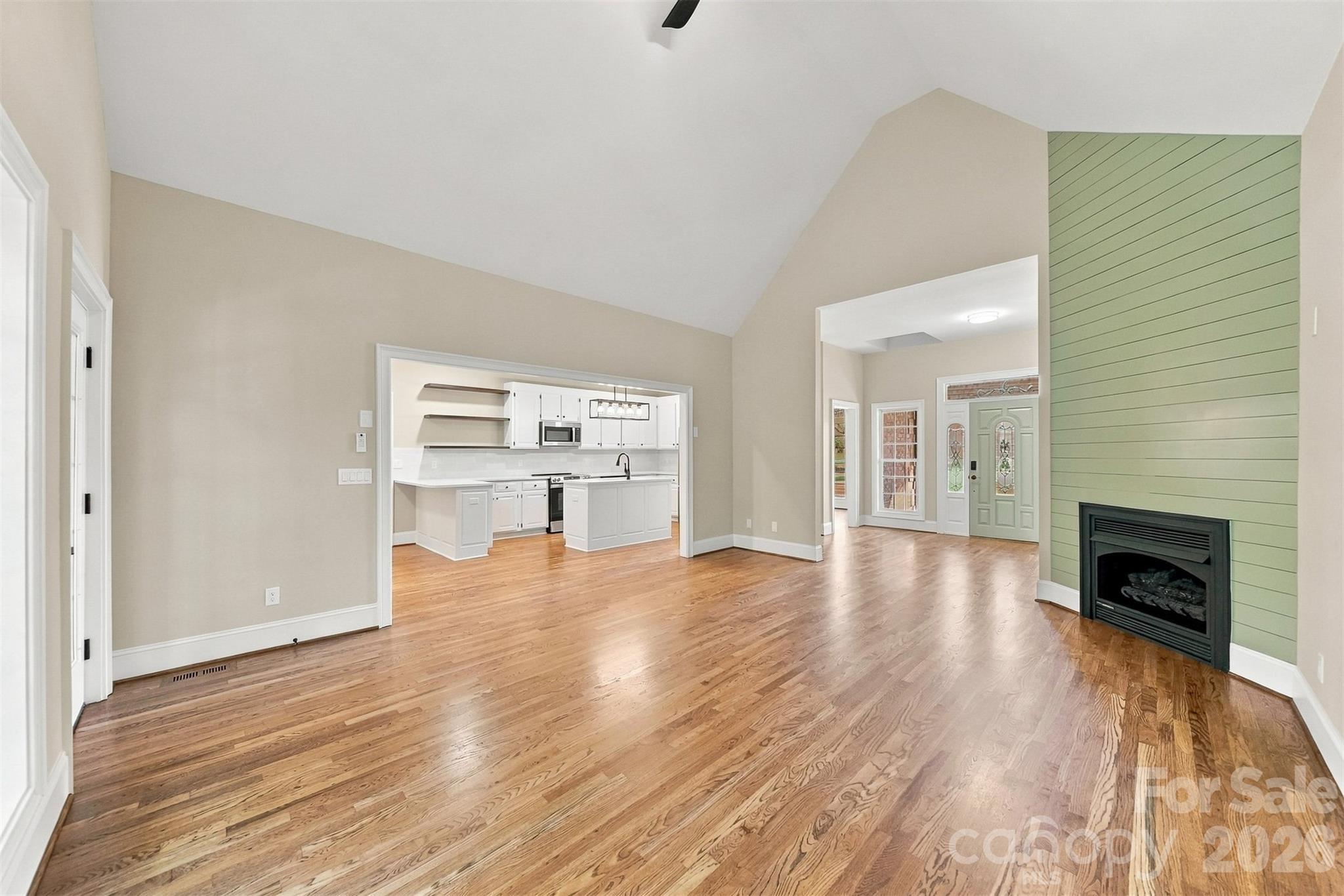 Original hardwood floors and a gas fireplace make the living area so cozy. - 3442 Sourwood Court, Lincolnton