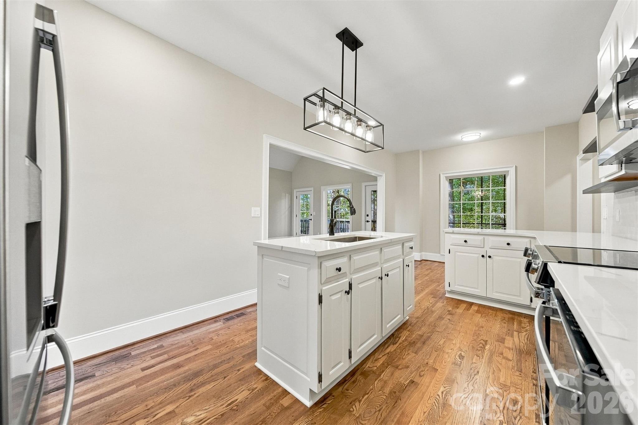 New light fixtures really make the kitchen bright! - 3442 Sourwood Court, Lincolnton