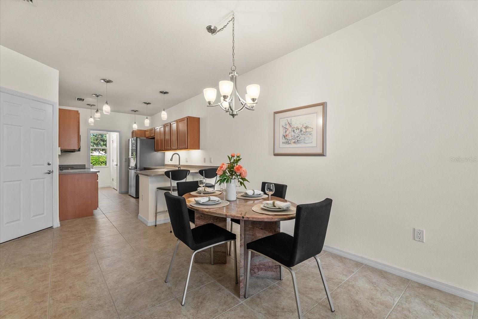 Dining Room open to Kitchen - 3810 82ND AVENUE CIR E #104, SARASOTA