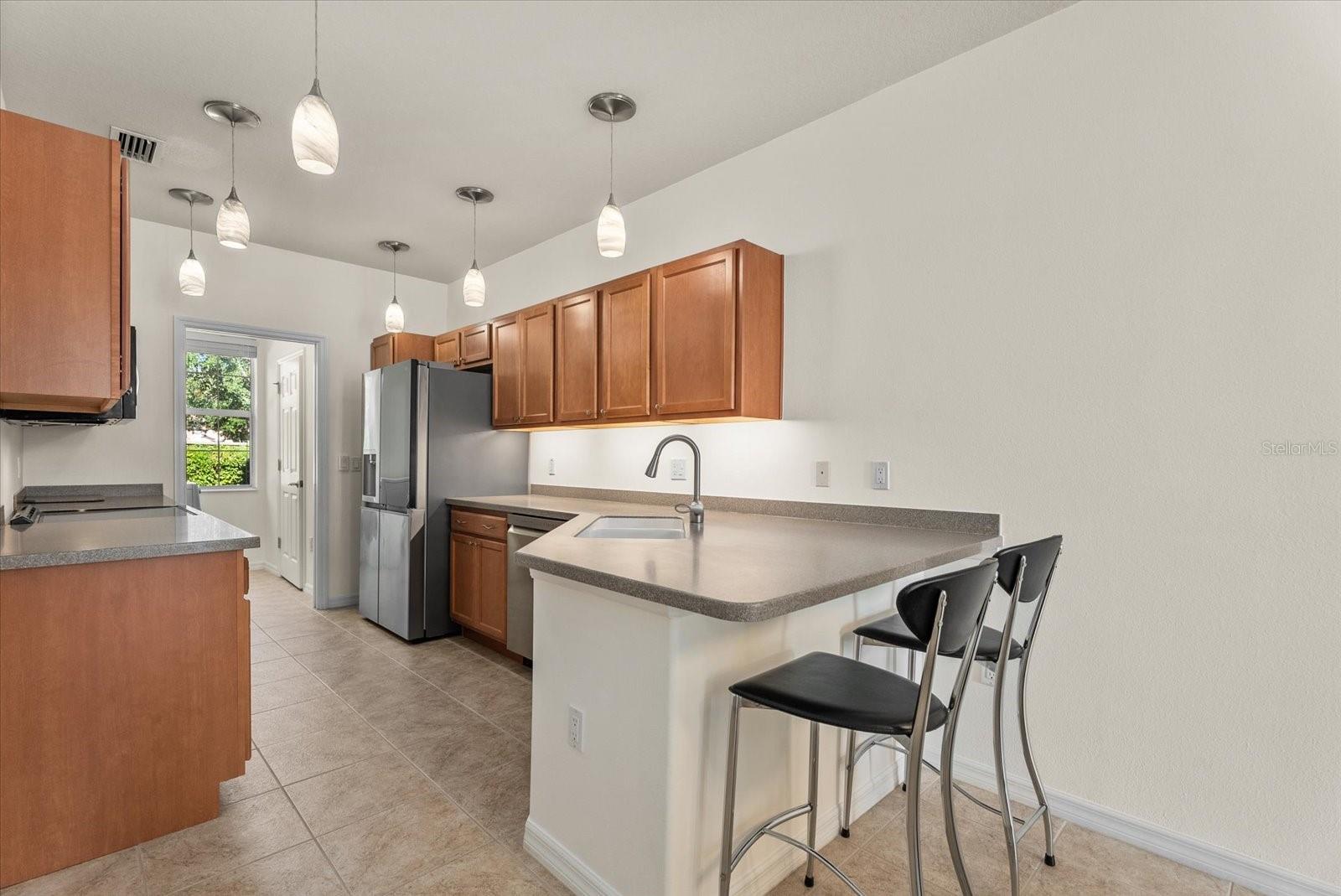 Kitchen with Breakfast Bar - 3810 82ND AVENUE CIR E #104, SARASOTA