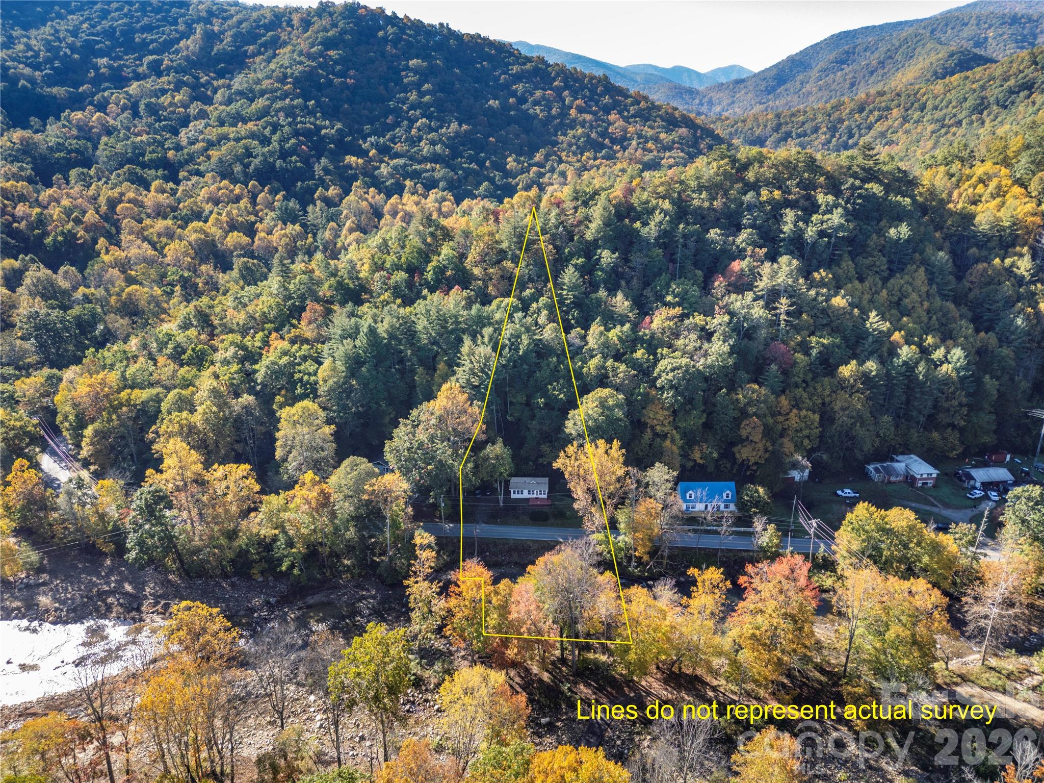 Aerial perspective of the home, river, and surrounding mountain landscape. - 13858 Cruso Road, Canton