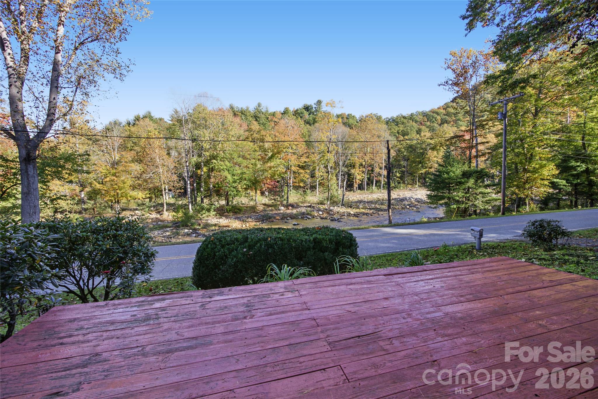 Enjoy peaceful river and mountain views from the front deck. - 13858 Cruso Road, Canton