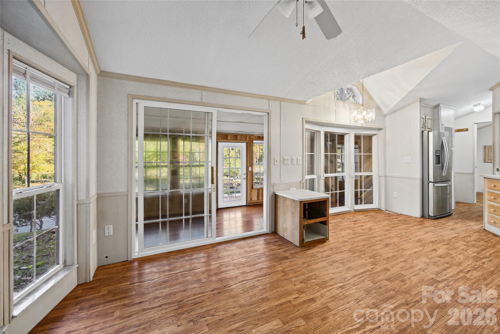 Sunroom connects to the main living area through sliding glass doors. - 13858 Cruso Road, Canton