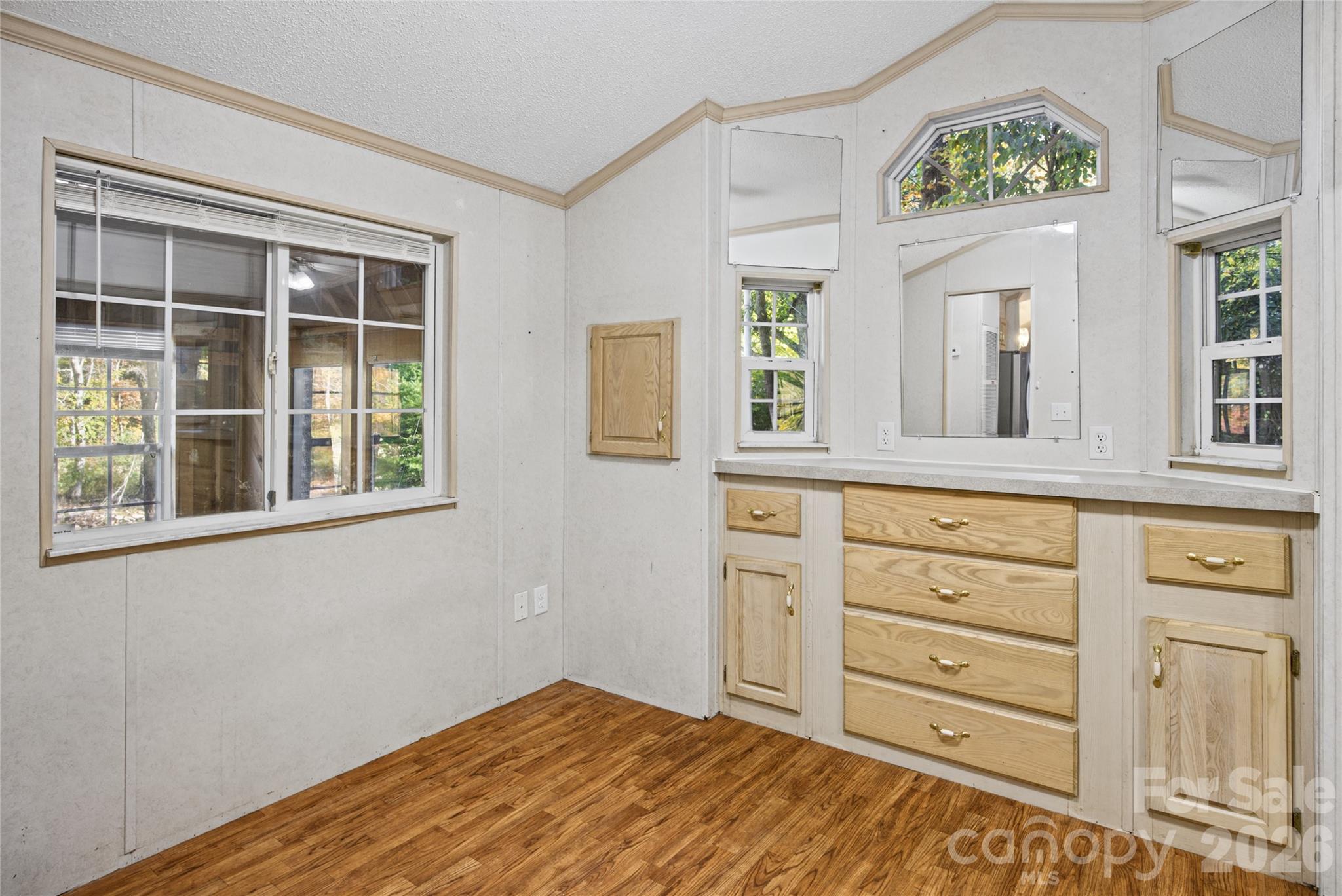 Bedroom with natural light and convenient built-in storage. - 13858 Cruso Road, Canton
