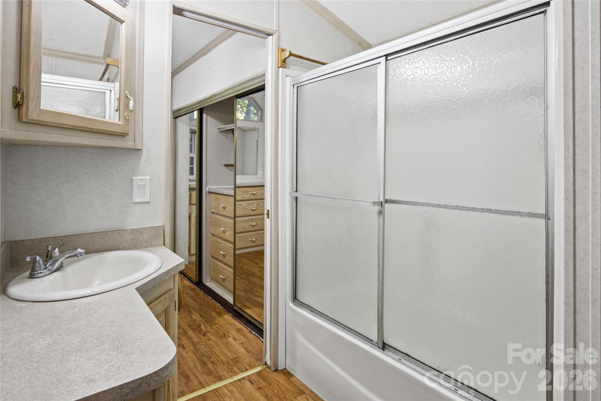 Bathroom opens to both bedroom and interior hallway. - 13858 Cruso Road, Canton
