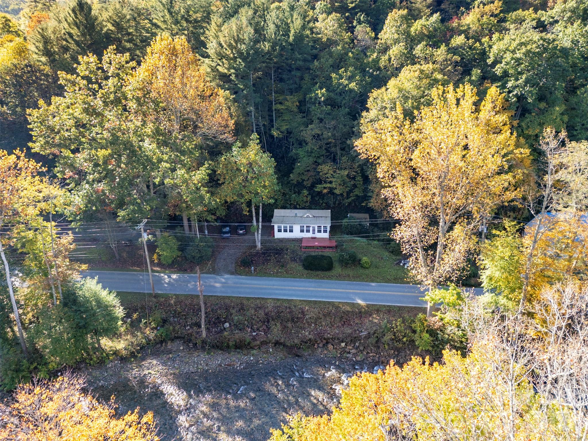 Aerial perspective of the home, river, and Cruso Road frontage. - 13858 Cruso Road, Canton