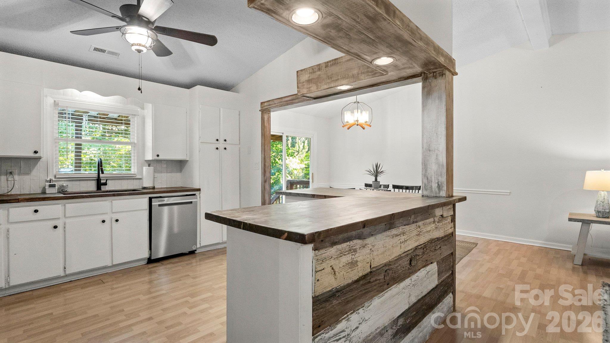 Updated kitchen with custom butcher block countertop - 105 Brockway Drive, Mooresville