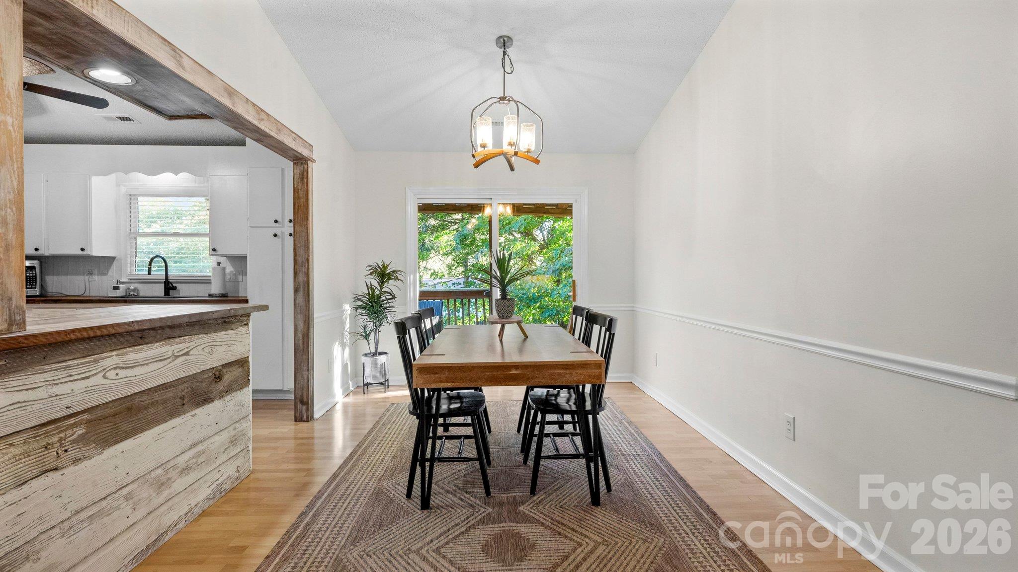 Sliding doors from the dining area to the private back deck - 105 Brockway Drive, Mooresville