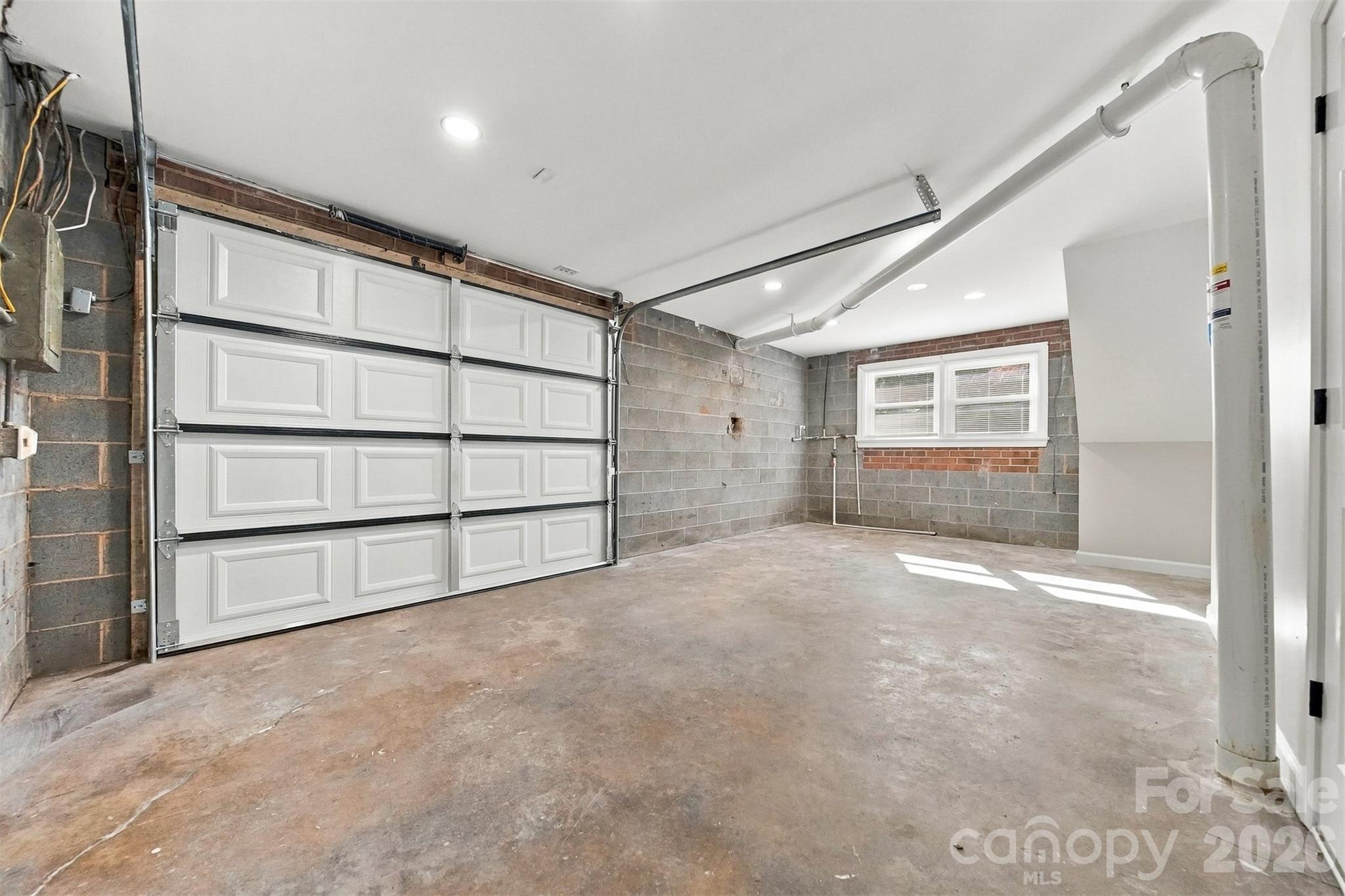 Attached garage with new door - 93 Mountain Oak Lane, Hickory