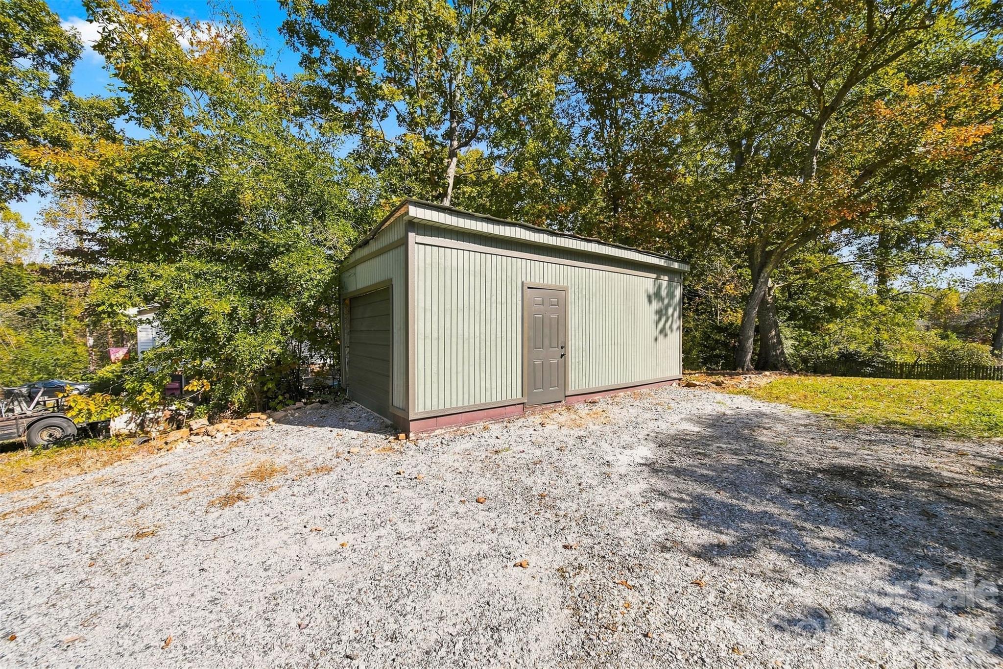 Detached garage/workshop has concrete floors and dedicated gravel drive - 93 Mountain Oak Lane, Hickory
